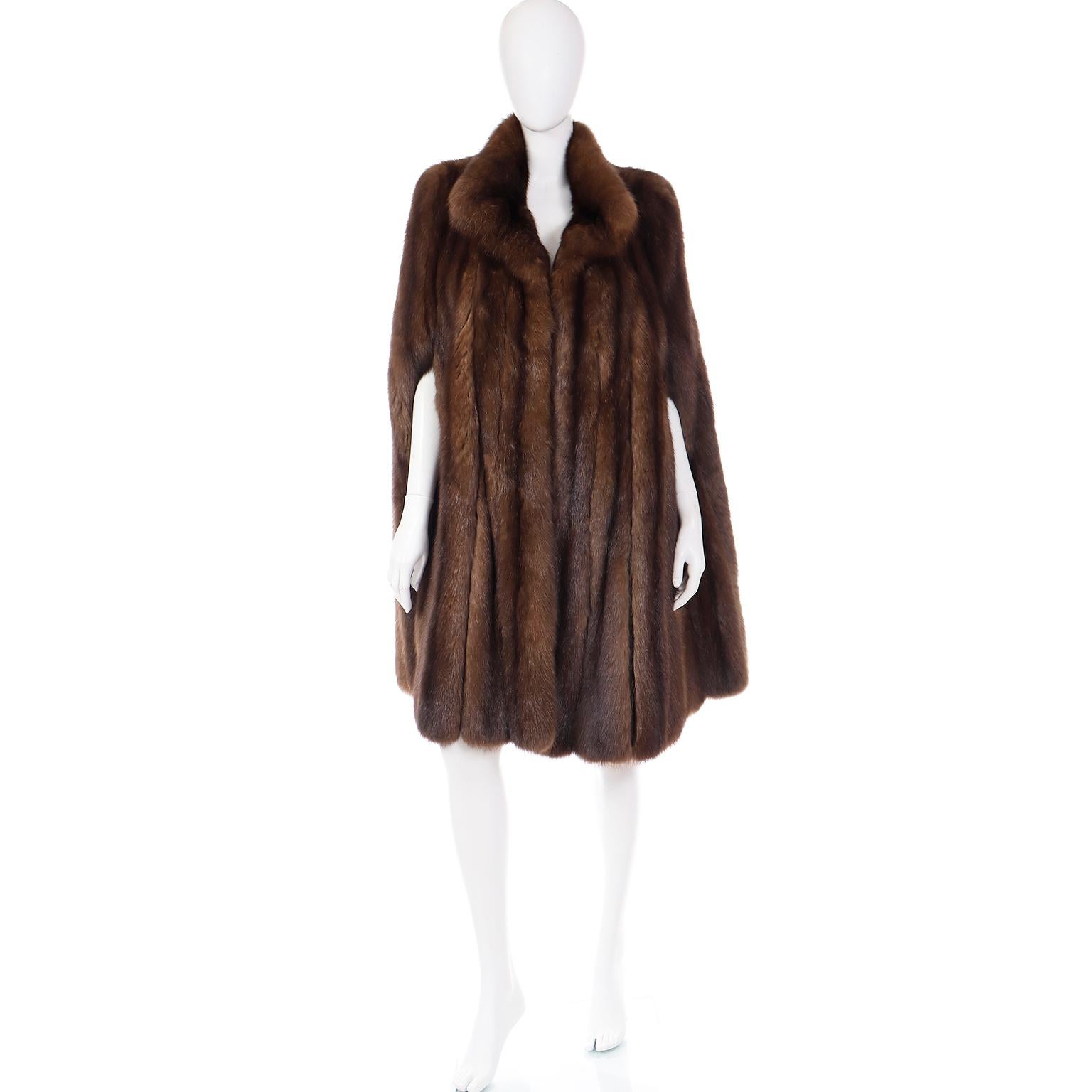 This is a gorgeous vintage Maximilian New York Russian sable mink fur cape. It's harder to find mink like this in a cape and this one is exceptionally luxurious. The coat is fully lined in silk and has slits for the arms. The original owner's