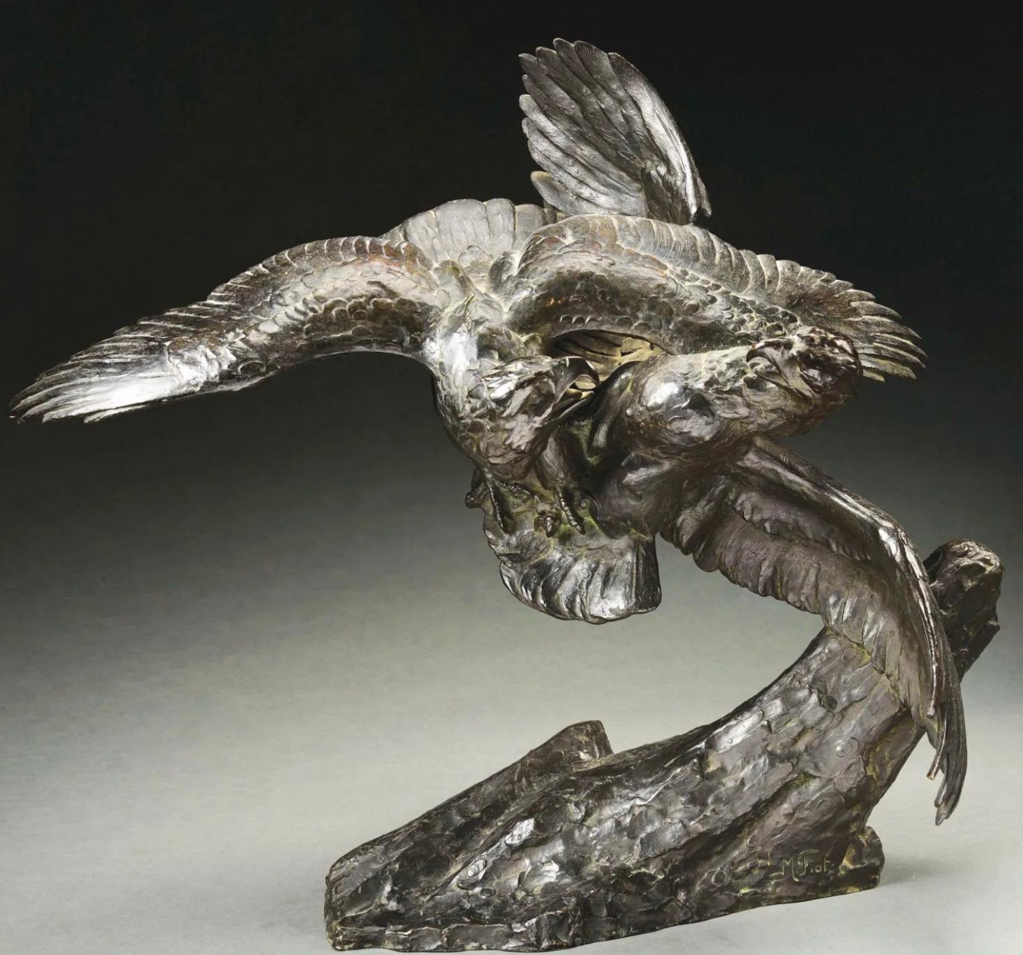 Maximilien Louis Fiot (French, 1886 - 1953)

A very large bronze animalier sculpture of combatant eagles in flight above an outcropping or rocks. The Eagles are fighting for their lives with claws dug in and beaks ready to strike. A very moving