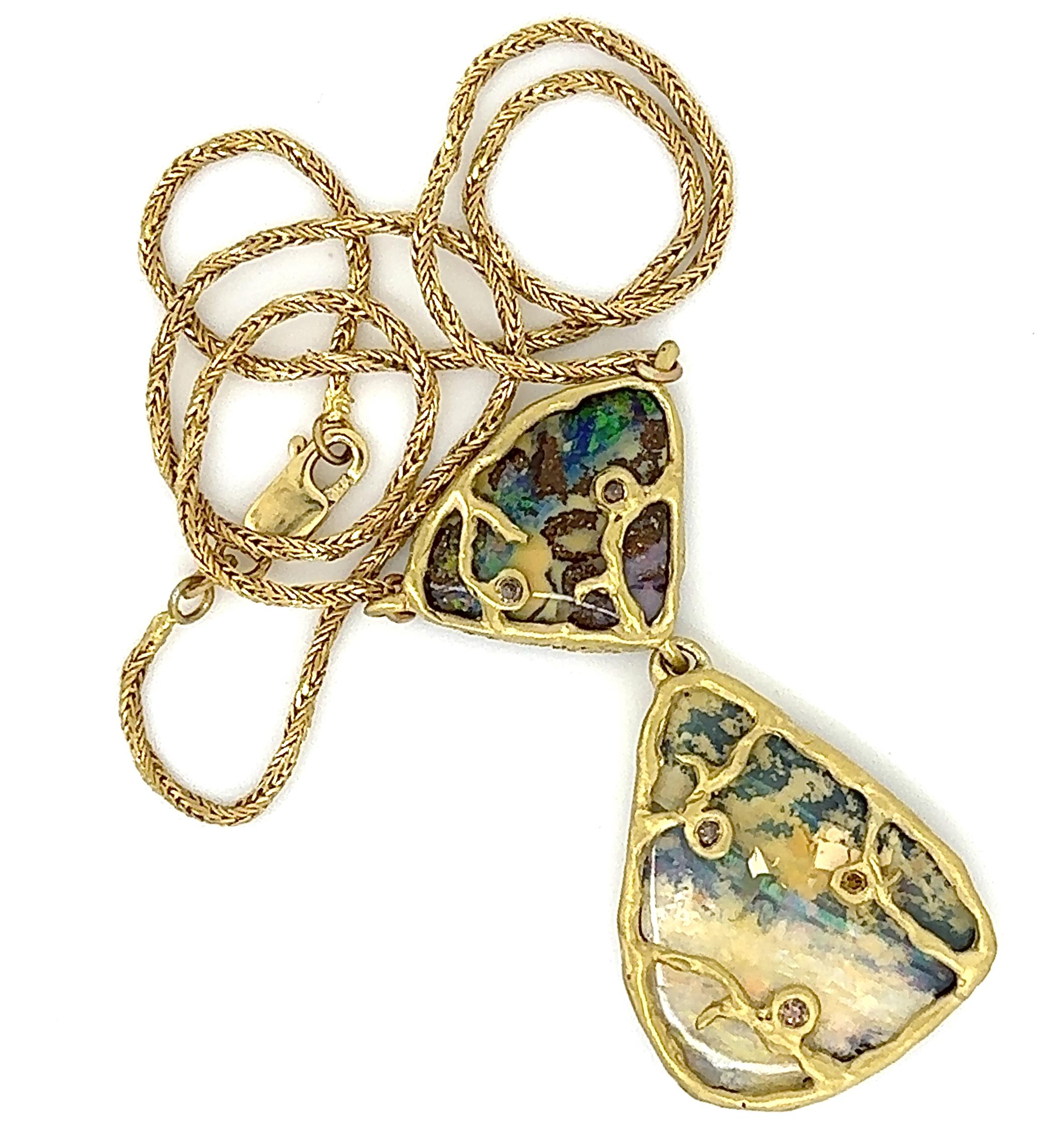 This one-of-a-kind showstopper by Eytan Brandes features two gorgeous and lively Australian boulder opals framed in gold and accented with natural brown diamonds.

The opals are from our good friends at Broken River Mining.  Their Yaraka mine, named