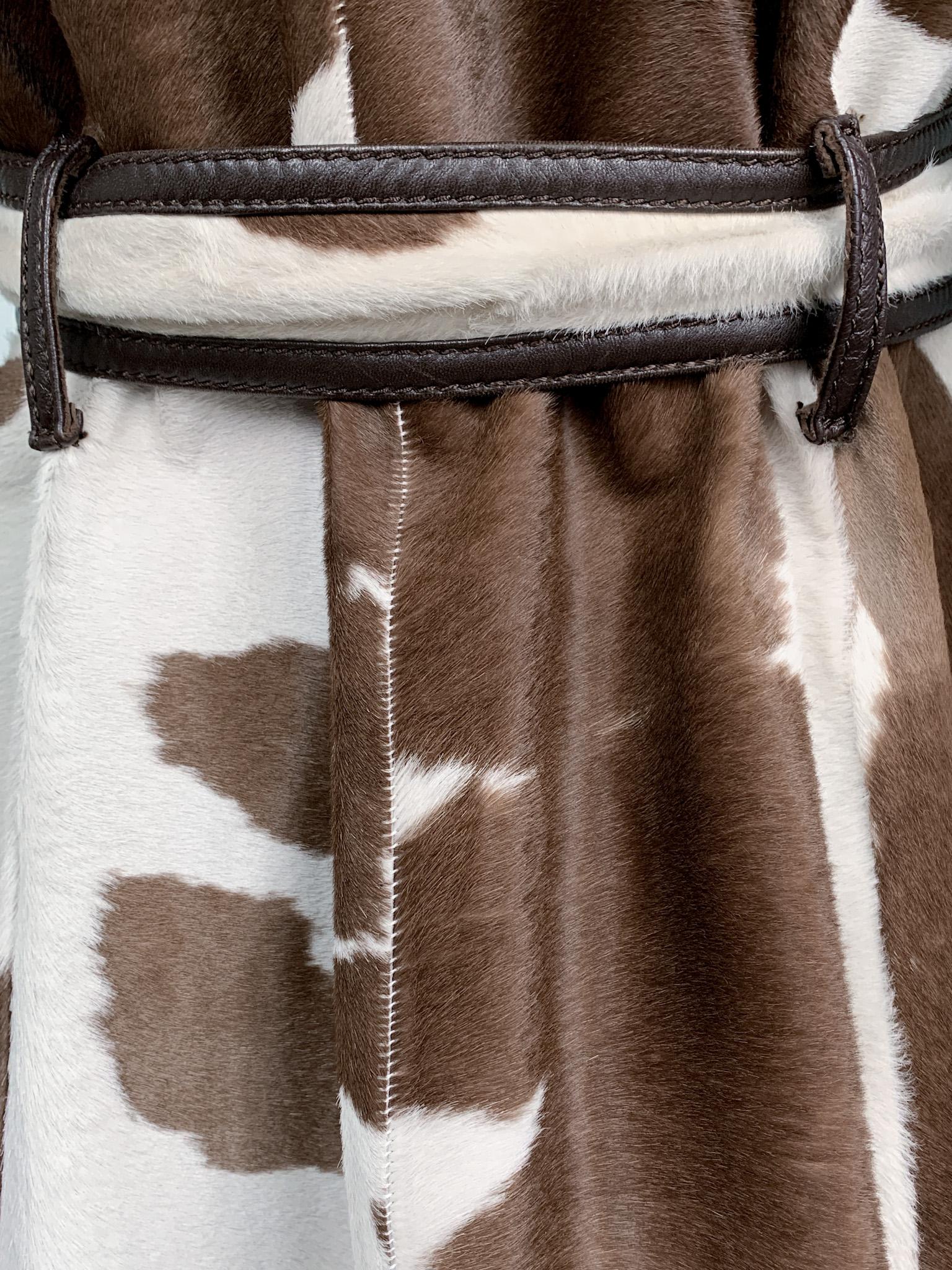 Max Mara calf hair leather long belted trench coat, seen at the Fall 2005 runway show (look 25). Very relevant with it’s timeless double-breasted design, exquisite quality leather, top-notch finishings and statement-making cow print.

100% leather;