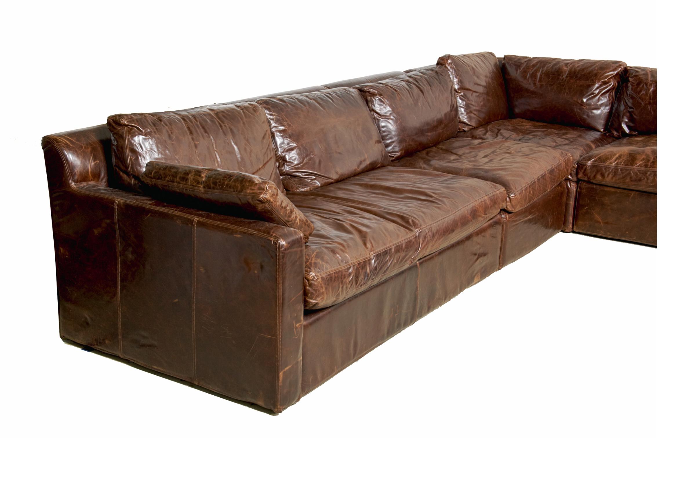 Luxurious brown leather sofa by Restoration Hardware. This is part of the Maxwell collection and has 4 sections. Super comfortable it has seen little use and will continue to gain character as it is sat in. Leather has a distressed finish, It