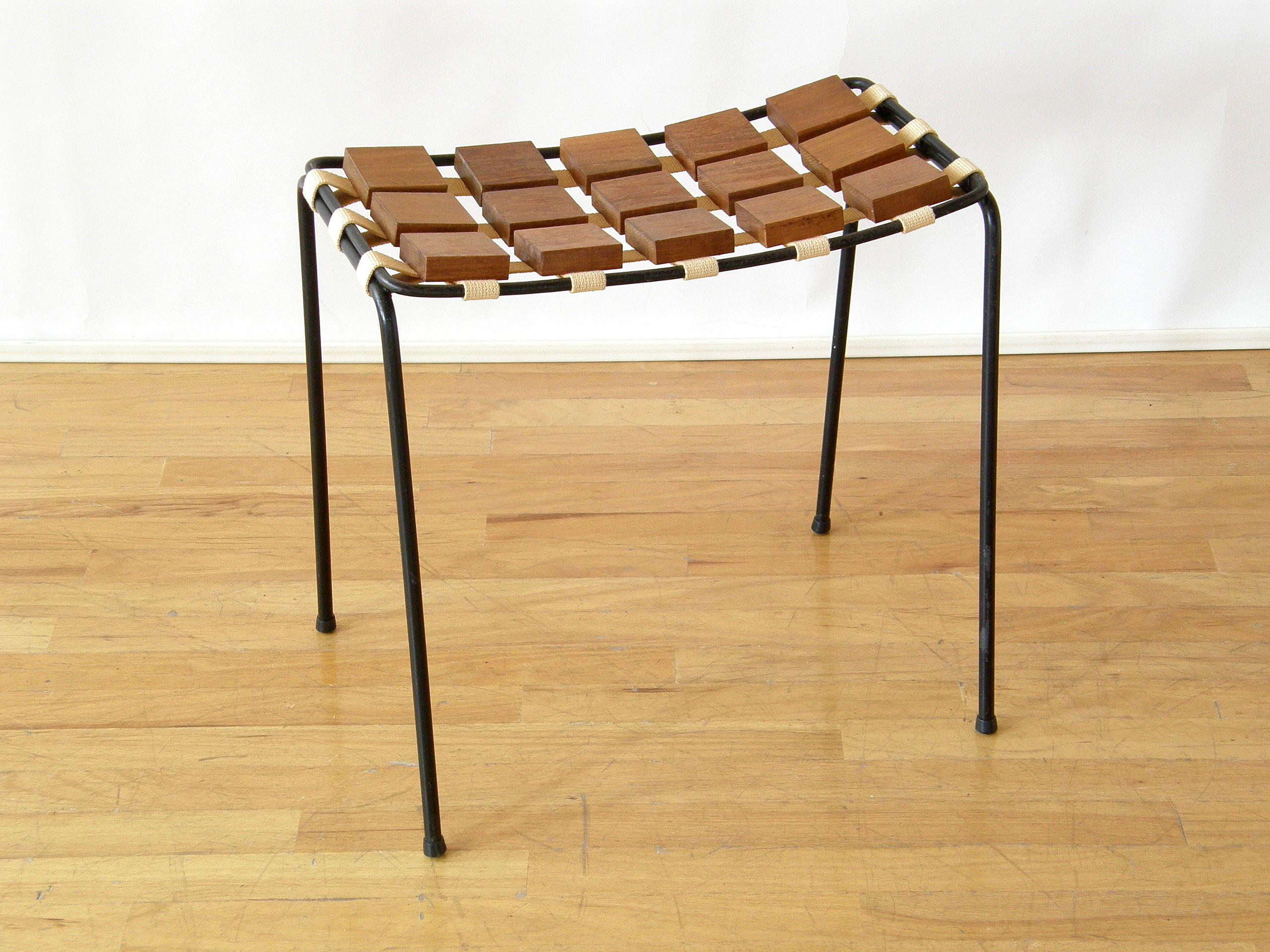This Mid-Century Modern stool was designed by Maxwell Yellen as part of his 
