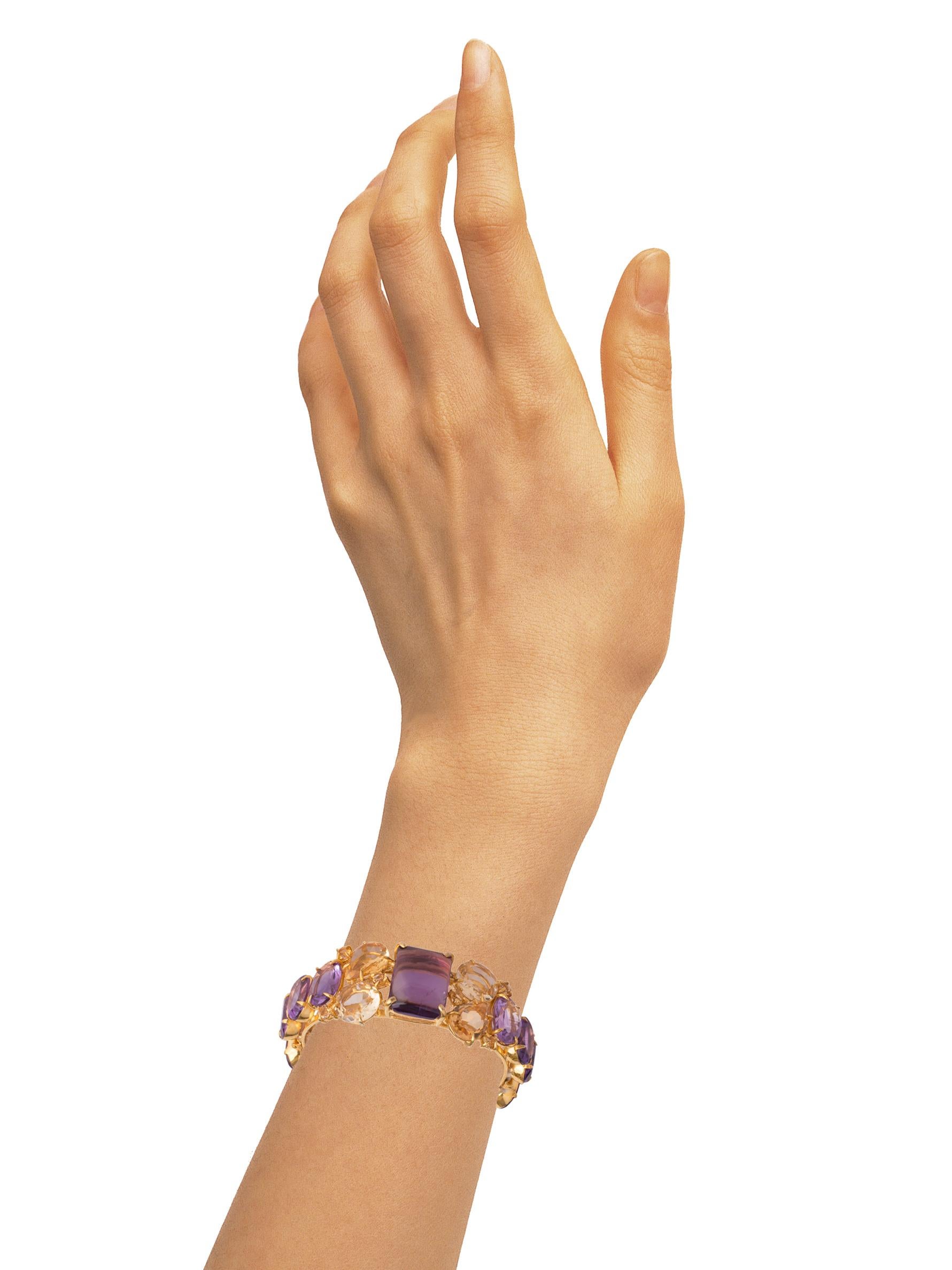The Maya Cuff, fashioned from semi-precious stones, features an open-hinged design. Its uniqueness lies in the vintage-inspired aesthetic, adorned with contrasting colorful stones.

SKU: CF-CL-14AM
Stones: Citrine & Amethyst
Material: 14K Gold