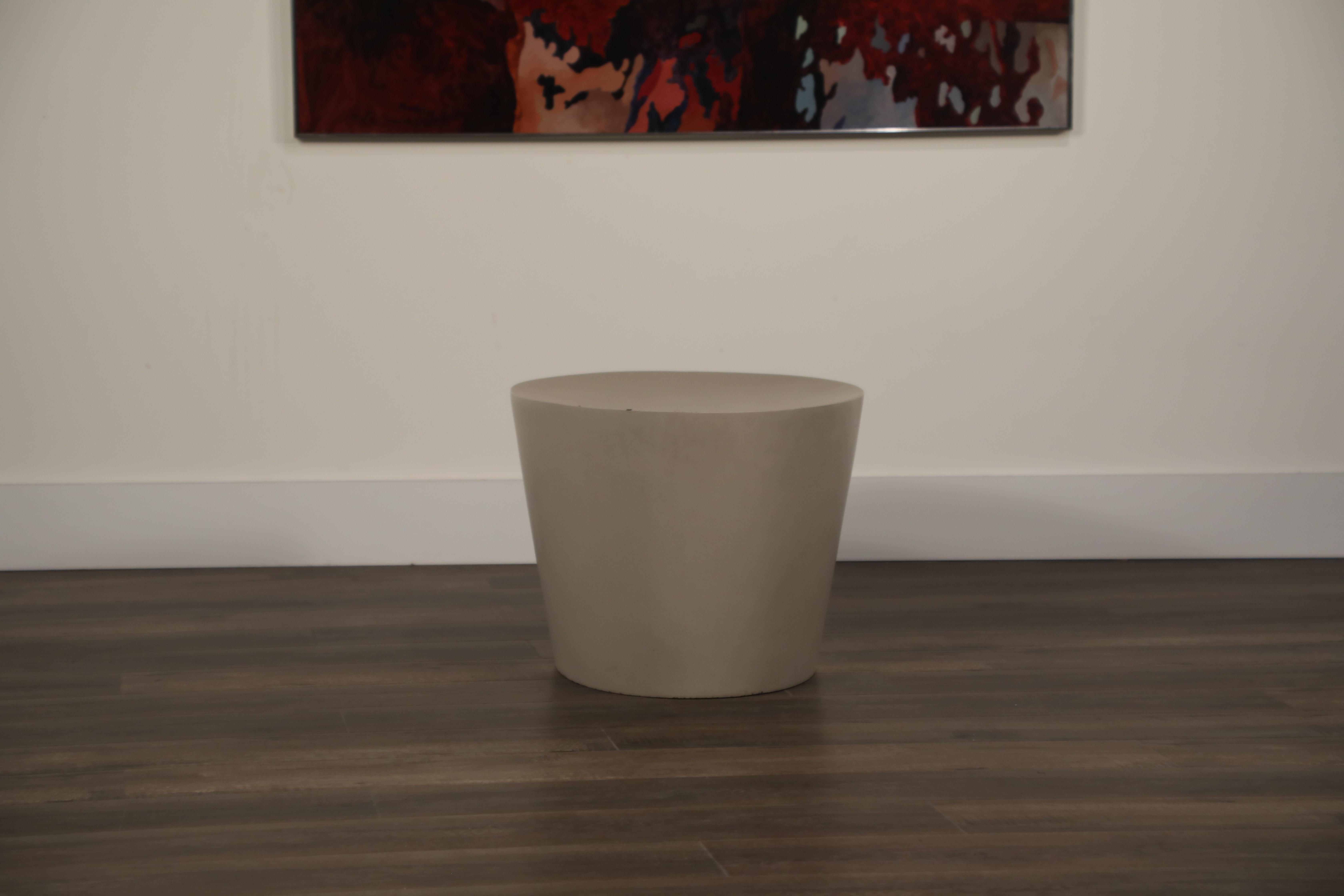 This first generation Maya Lin stool is no longer in production, making this fine example a rare and coveted collectors piece, and is fabricated of molded concrete, unlike the polyethylene (plastic) modern versions of today. This incredible example