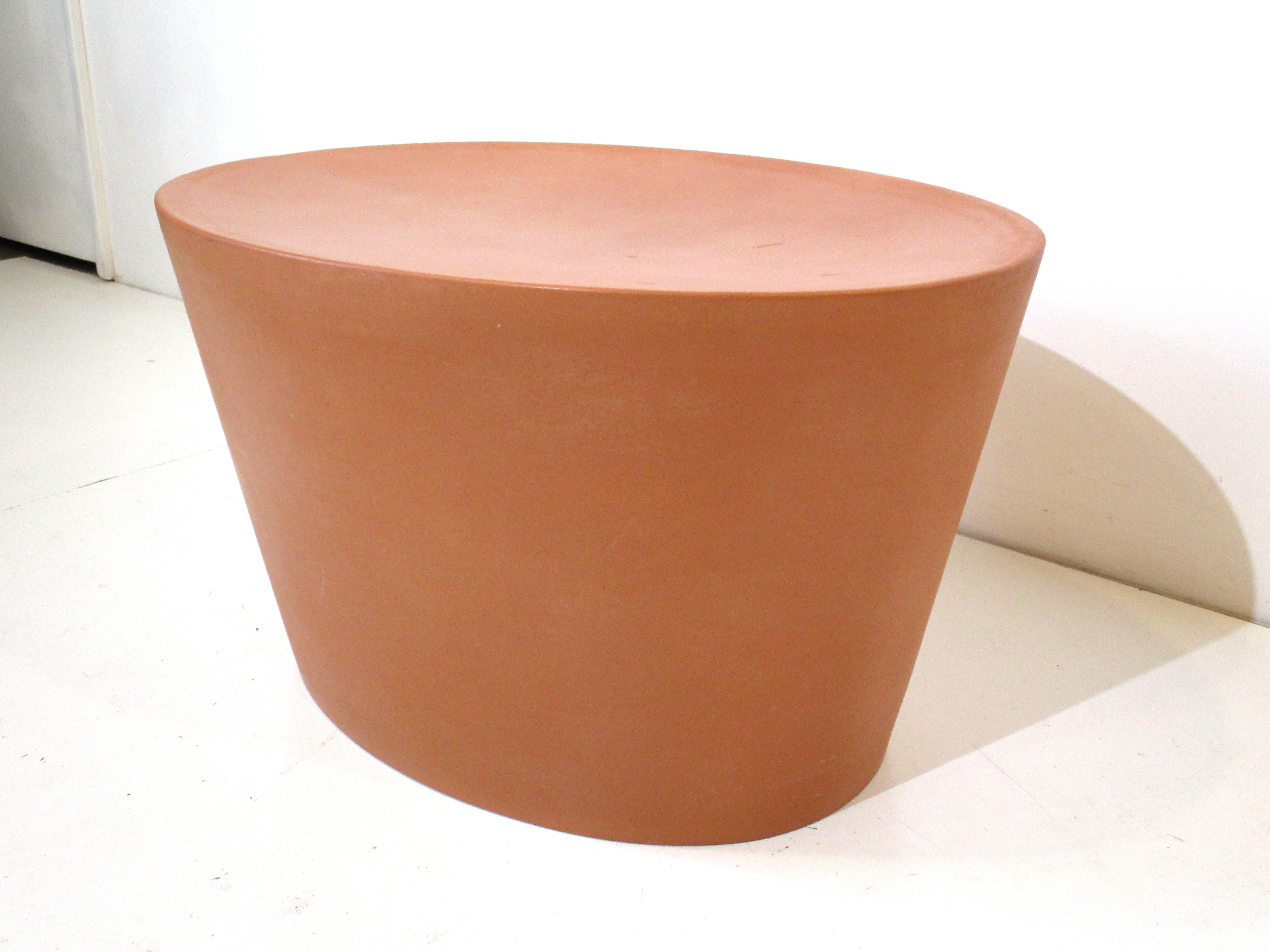 A first generation solid concrete stool or coffee table designed by Maya Lin which used a tinting process for coloring. Only the first gen where made of concrete and after that they were made of a ABS type colored plastic. Produced by the artist