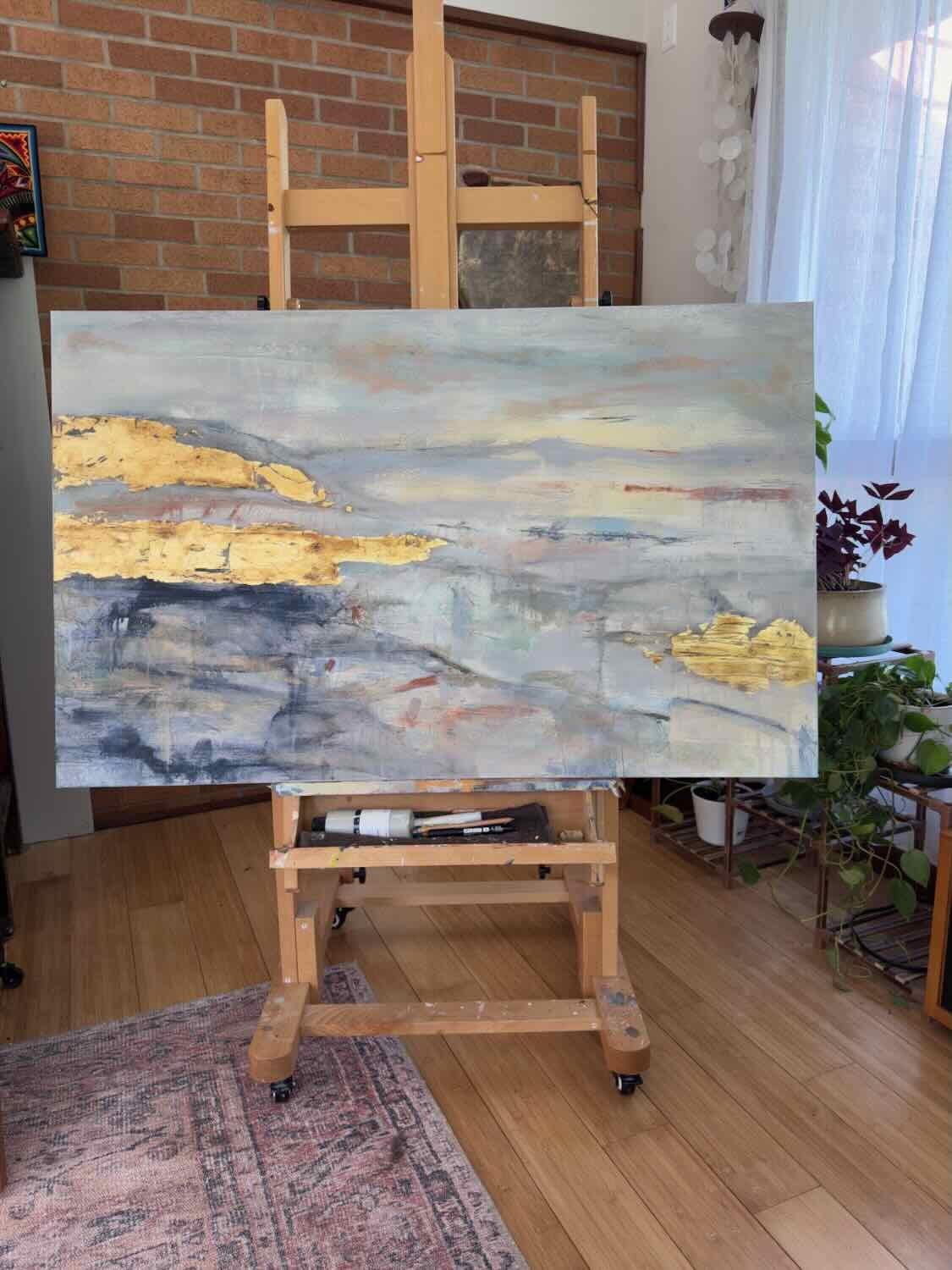 <p>Artist Comments<br>Artist Maya Malioutina layers acrylic paint, charcoal, and gold leaf to create a luminous, textured landscape that evokes the threshold between life and death, matter and spirit. Soft grays and indigos dissolve into radiant