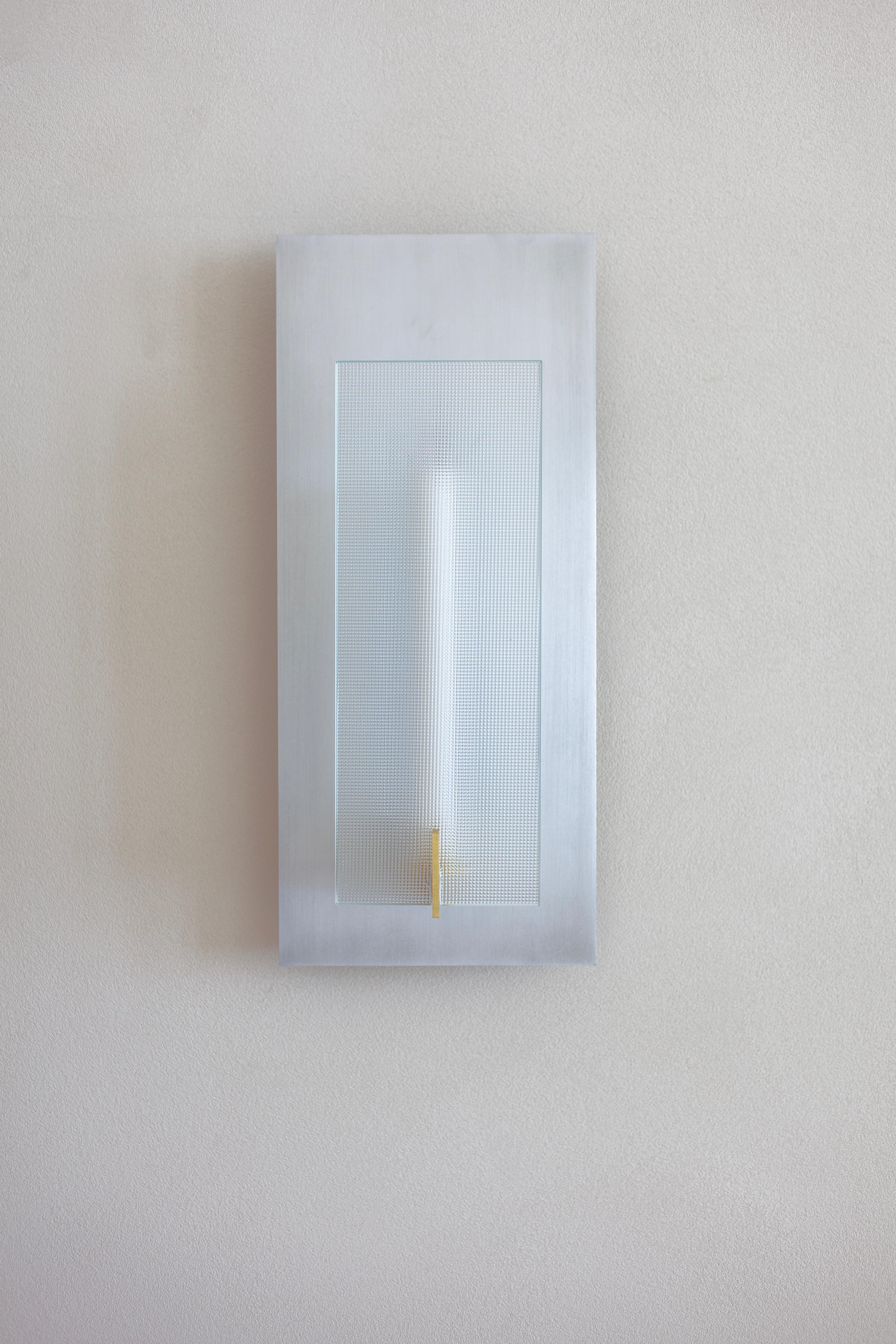 Maya Sconce by Morghen Studio
Dimensions: W 20 x D 11 x H 46 cm
Materials: Satin brass, Satin aluminum, Textured glass, LED light, Candle.

Standard features:
Light source: COB LED - 24v DC - 10w - 2700k
Driver: onbboard (AC110-240V/DC24)

Designed
