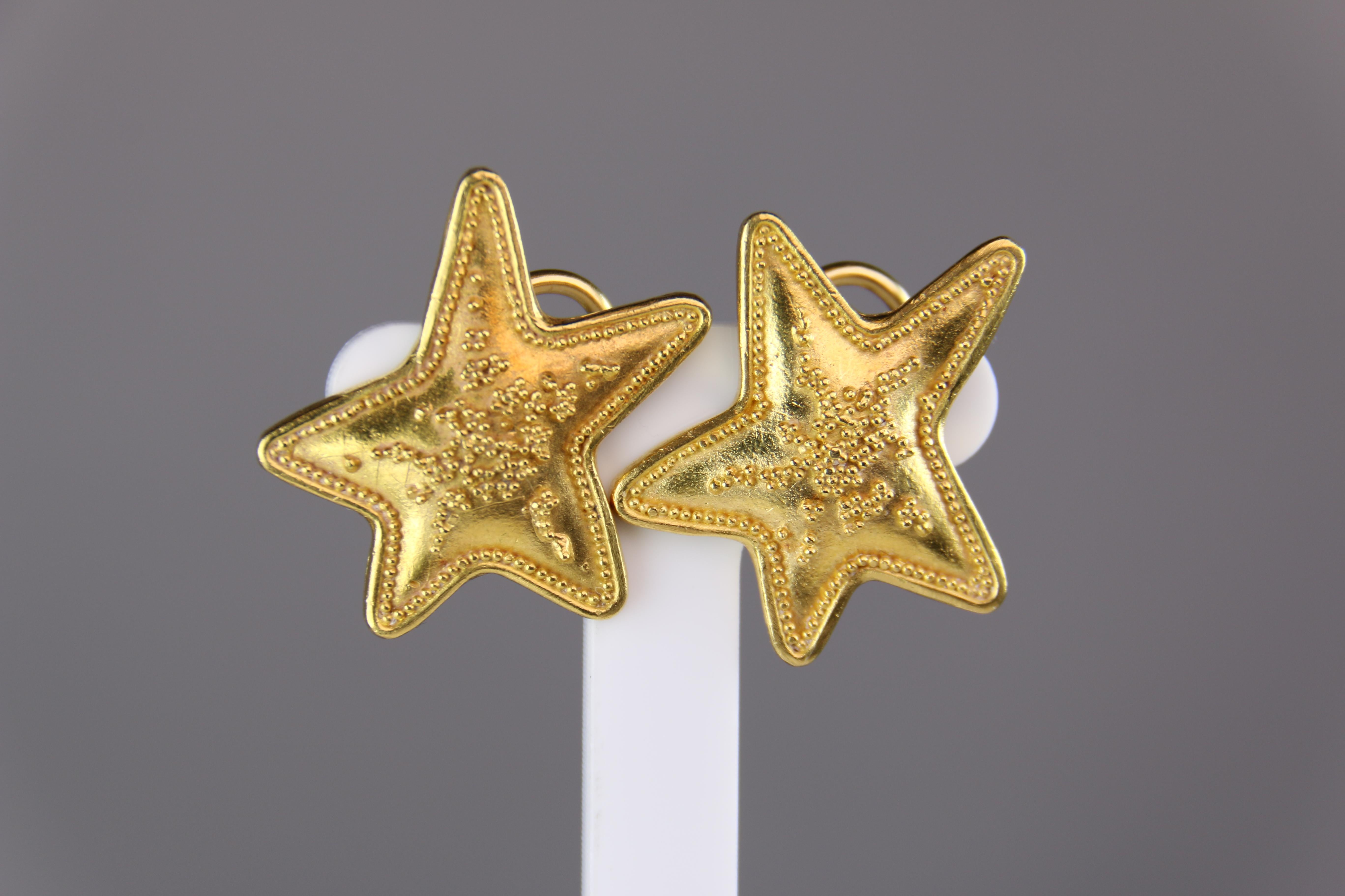 These Star Design Earrings are truly one of a kind. They are hand crafted in yellow gold slightly domes tops with applied granulation work then hand engraved on the flat reverse with designers signature 