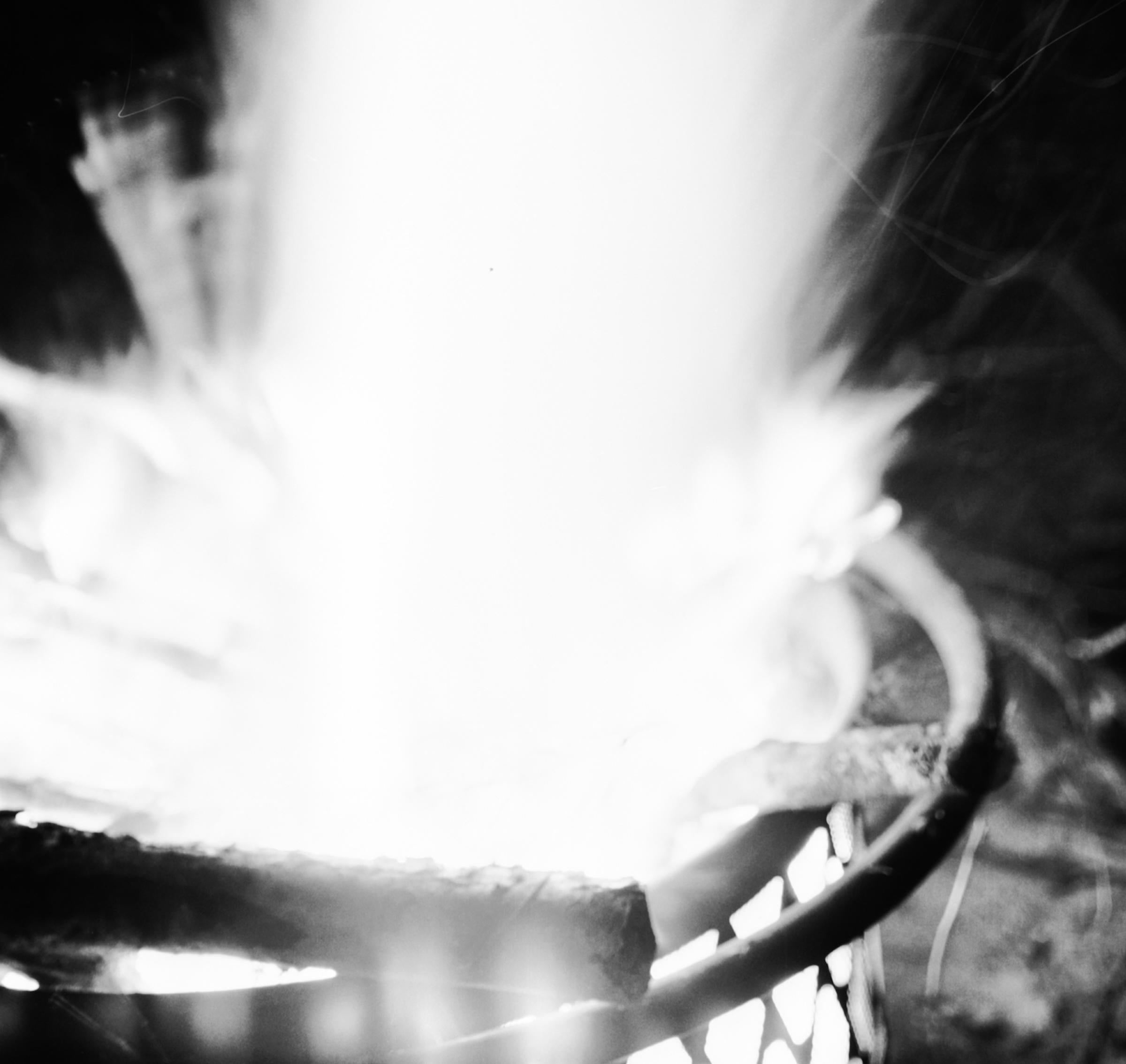 Contemporary archival inkjet print of hands reaching towards flames of a blazing fire. Edition of 5. Available unframed, please inquire for mounting or framing estimates.

Maya Tihtiyas Attean is a Wabanaki artist raised on the Penobscot Reservation