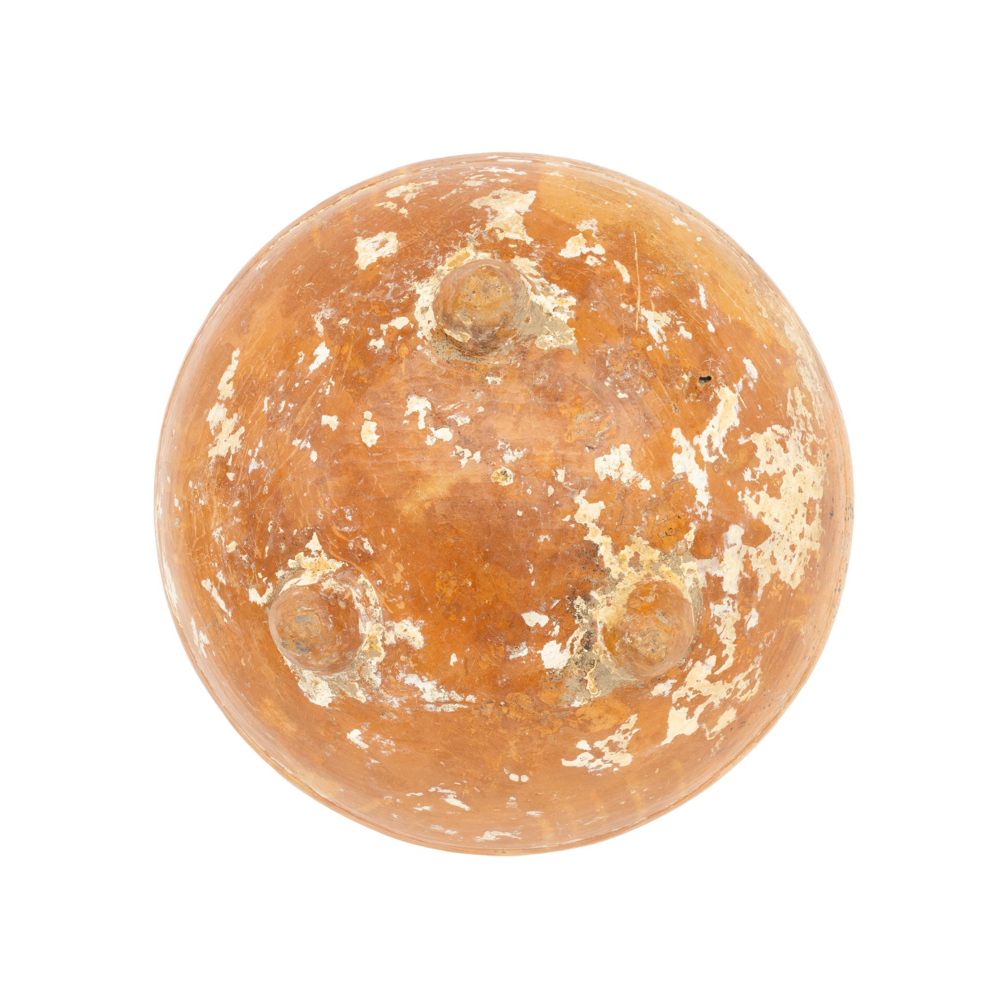 Mayan Bichrome Tripod Bowl (Usulatan Ware). Quiche Area, Guatemala. C. 200 - 950 CE/ Mayan. Intact with small rim chip. Light orange and dark Mayan bowl is lightly impressed with a subtle geometric design on the outside. Authenticated and attributed