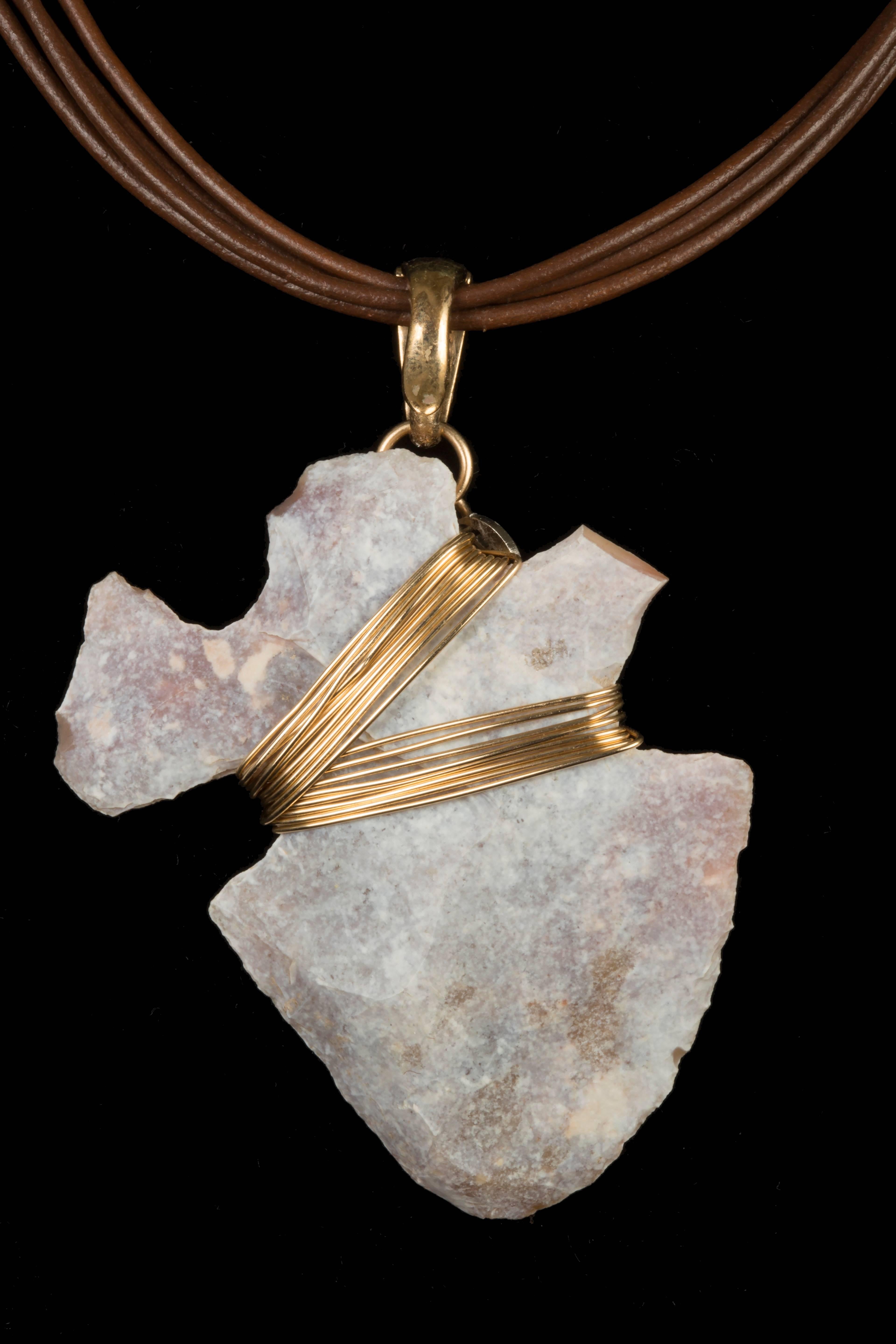 The soft colors in this amulet are delicate and feminine. The shape of the rock itself denotes life. Some say this was carved to represent a woman, others a heart. 