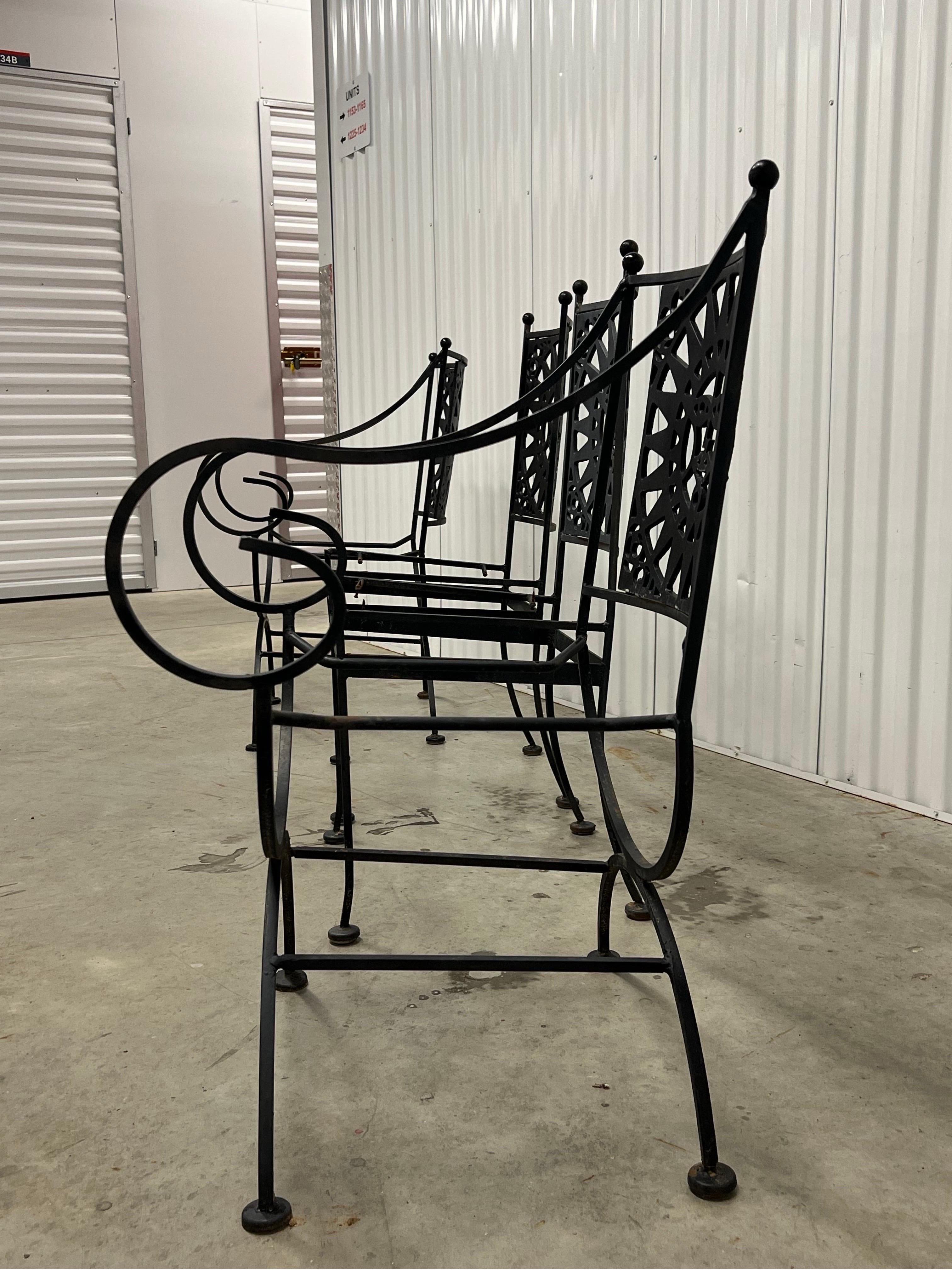 This striking mid-century iron table, designed by Arthur Umanoff, features a clean and elegant design that perfectly blends style with simplicity.