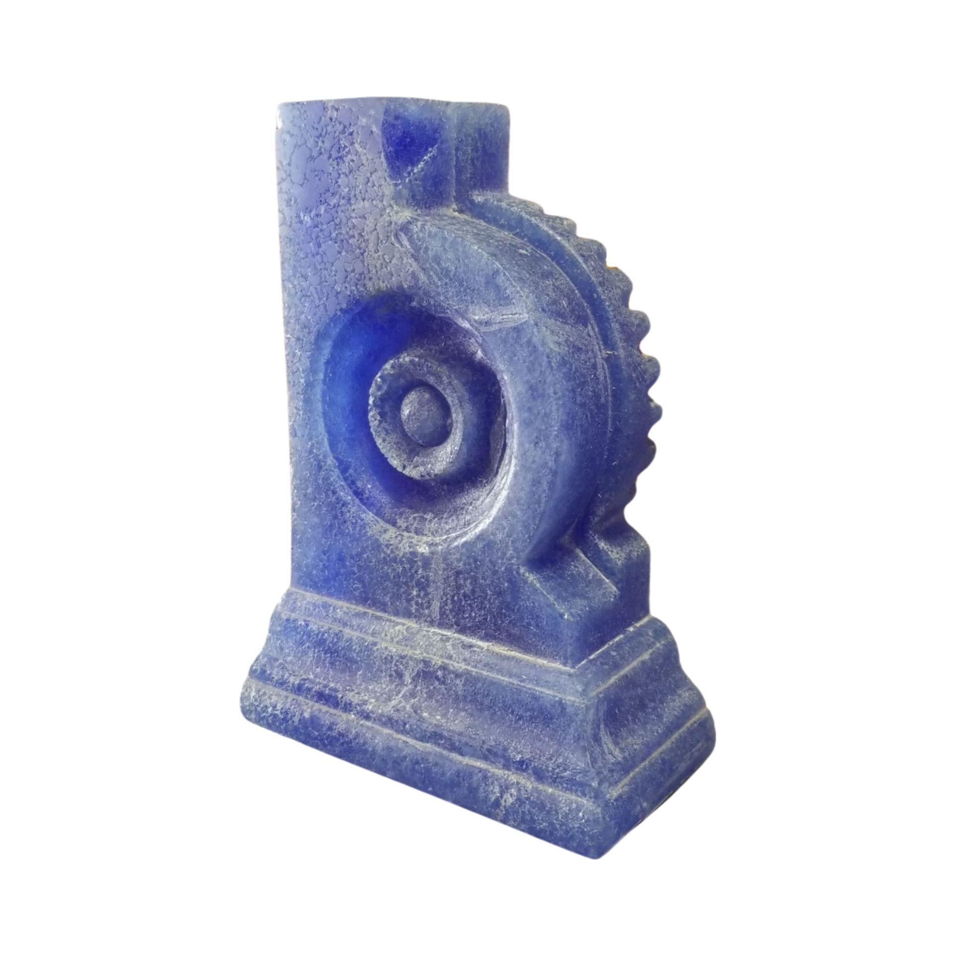 Hand-shaped blue Pâte de Verre glass bookends featuring a modernist abstract form heavily influenced by Mayan patterns carved and wet sanded. 
Echted with the signature R Ricky
Excellent handmade quality. There are some chips as seen in second