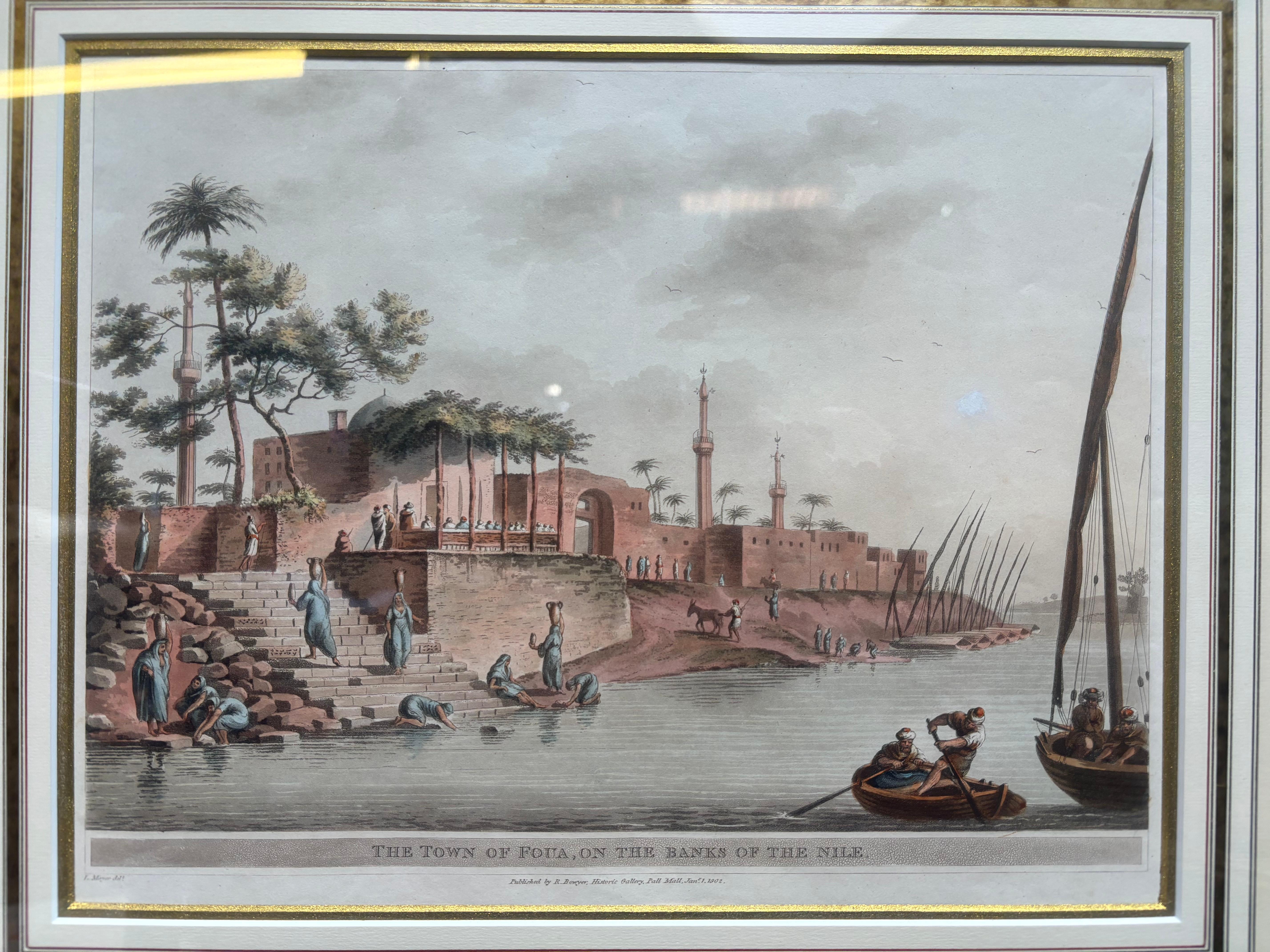 Photo Details:
Hand-coloured etching by Luigi Mayer (1755-1803) entitled 'The Town of Foua, Banks of Nile'.

Frame Details:
Hand-gilded with 23K Gold. Gold is continuous.
