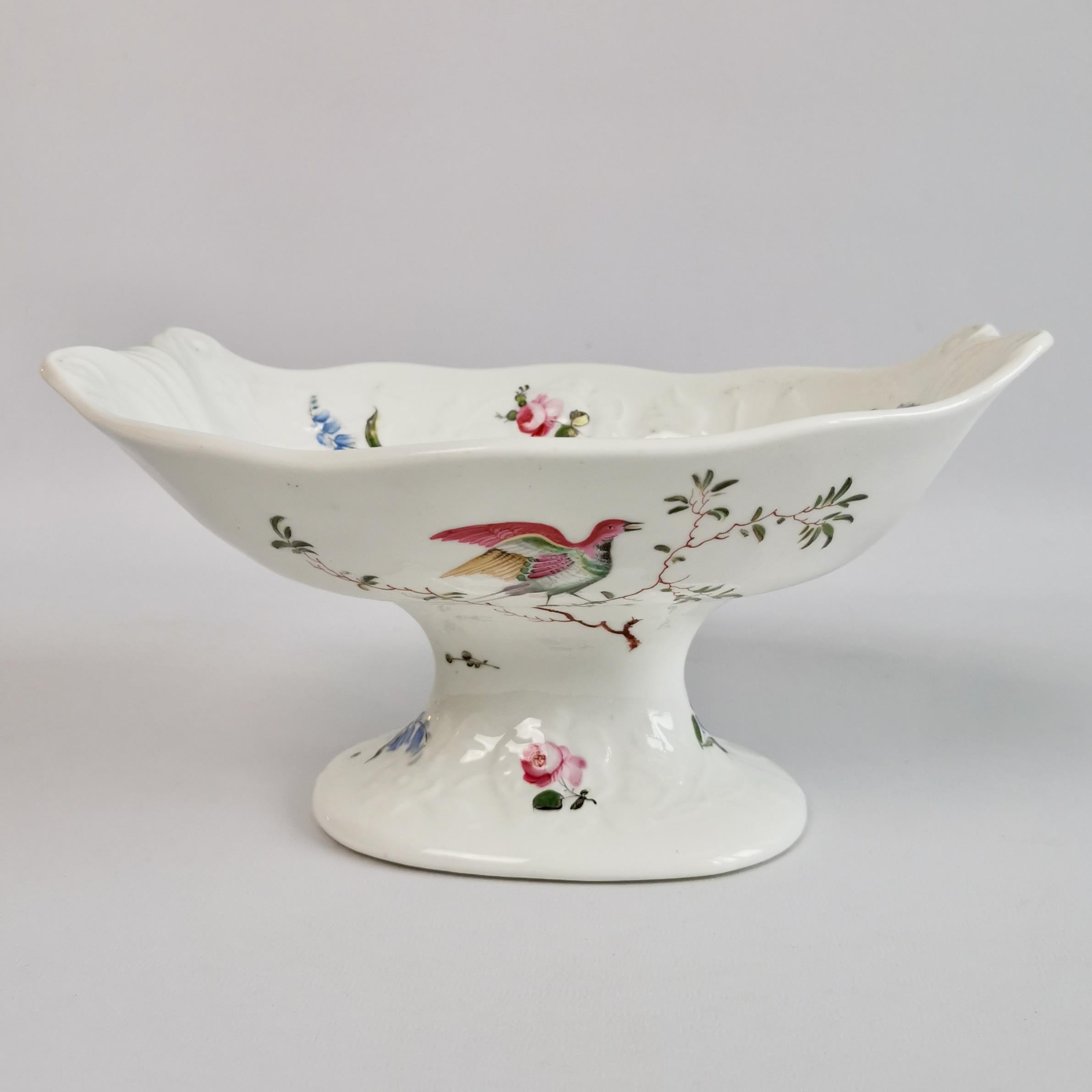 This is a stunning comport or centre piece made by Mayer & Newbold in about 1820. The comport is white and blind-moulded with beautiful hand painted exotic birds.
 
This comport would have formed the central serving piece to a large dessert