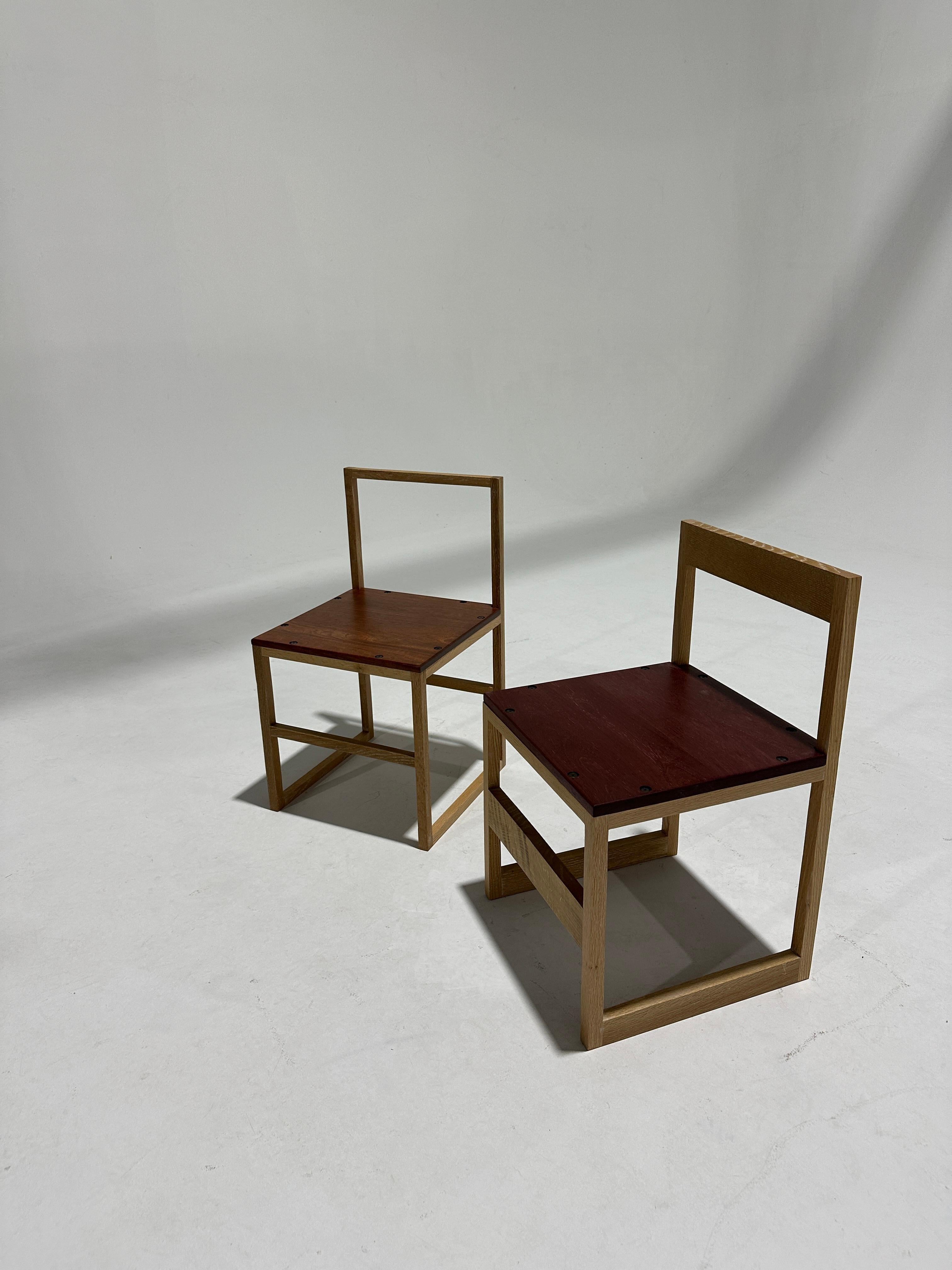 American Craft, hand made accent chairs . Made from white oak, padouk and purple heart wood. These chairs are produced by Mayfly Studio under designer Michael Oates. Drawing influence from the New Hope area and its neighboring river towns, paying