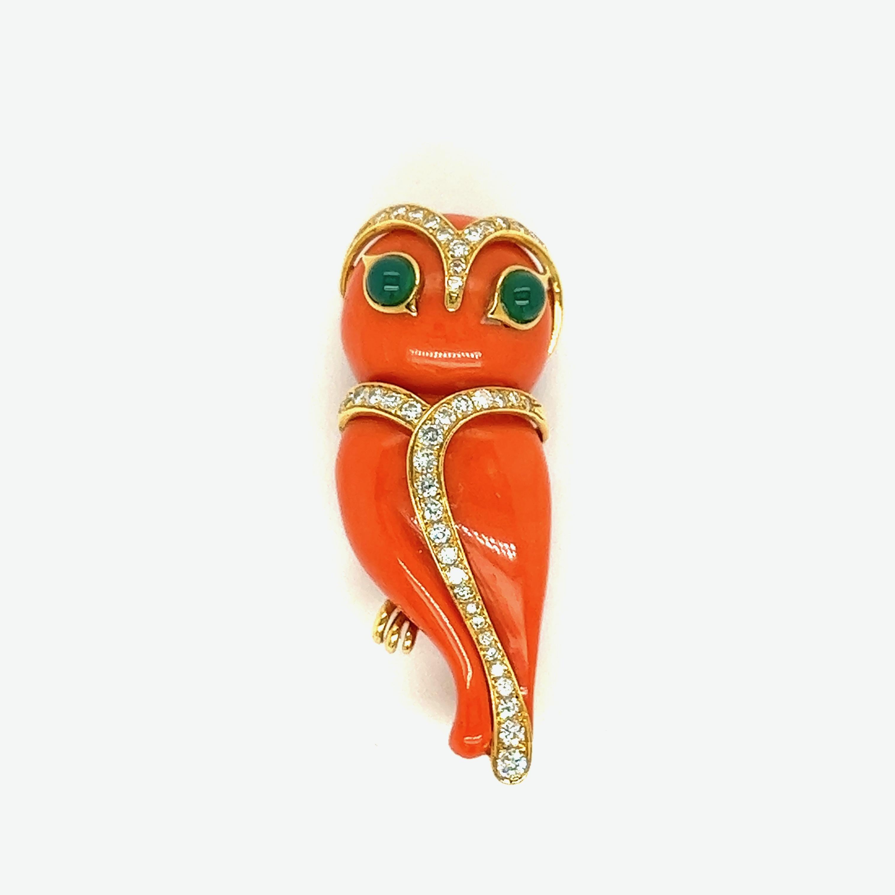 Mayor's Coral Diamond Green Carnelian Owl Brooch, French

An adorable owl made of coral with green carnelian cabochon eyes and cascading round-cut diamonds of approximately 0.70 carat on the head and midline, set on 18 karat yellow gold; marked
