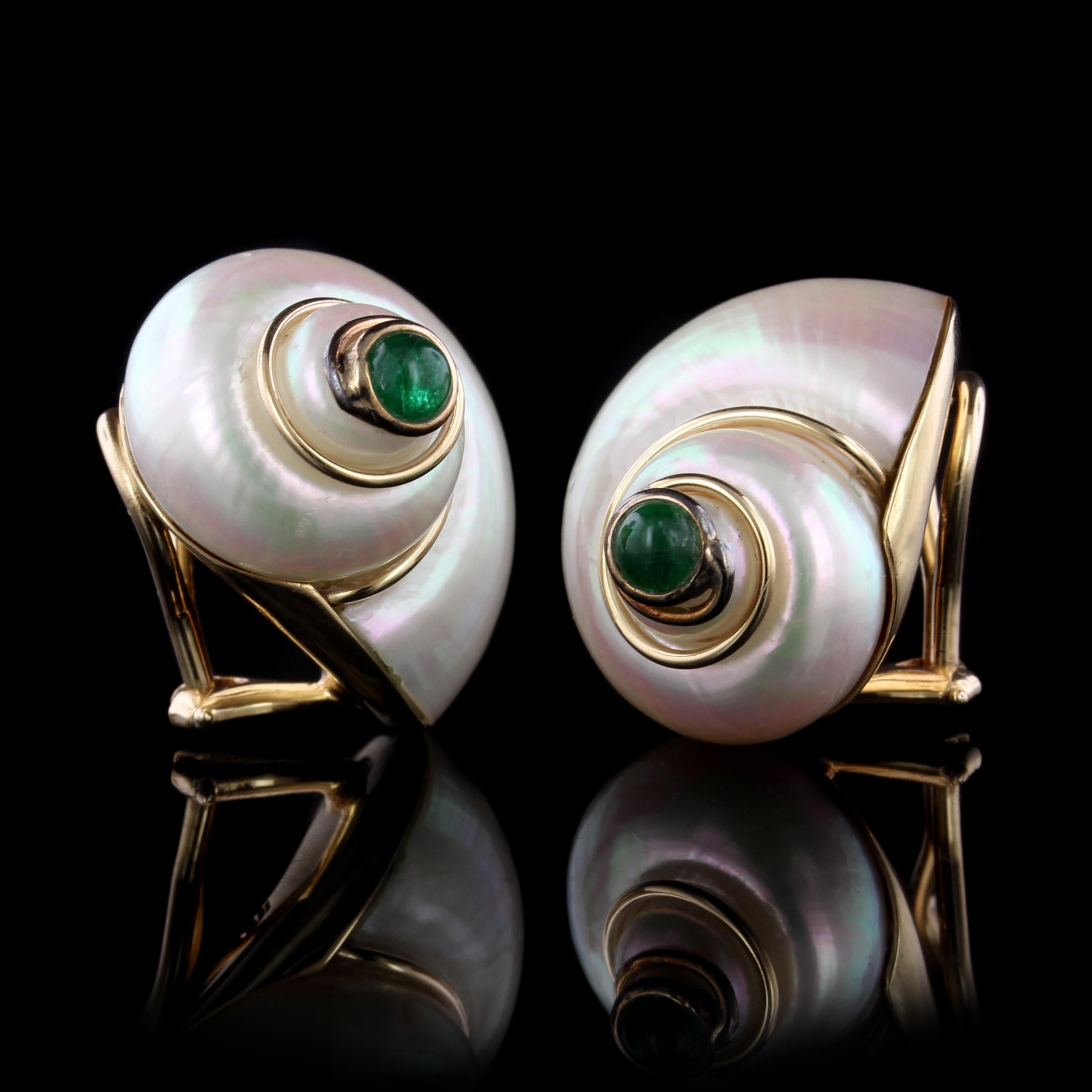 MAZ 14K Yellow Gold Turbo Shell and Emerald Earrings. The earrings are designed
with white turbo shells bezel set with two cabochon emeralds each measuring
4.00mm., length 7/8