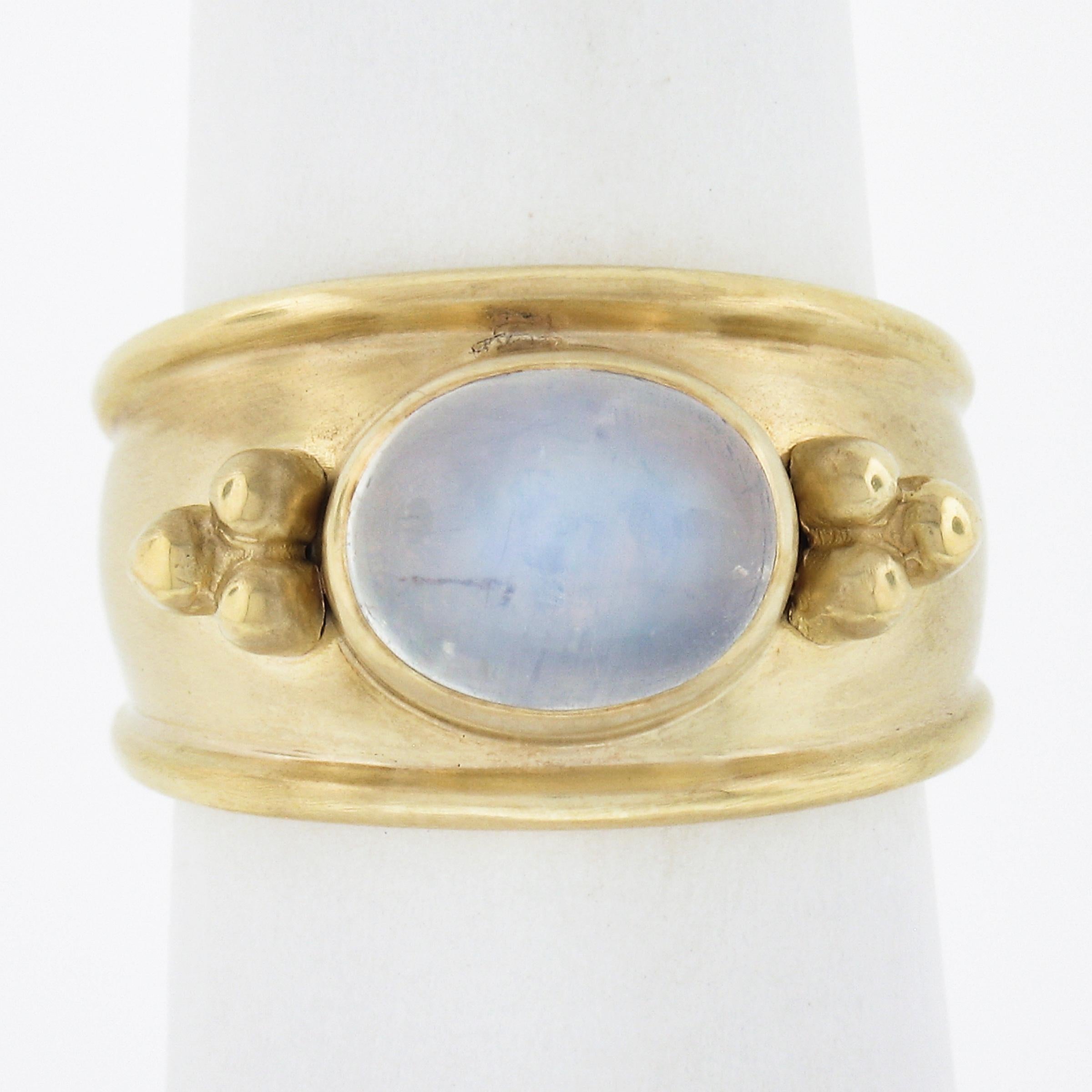 --Stone(s):--
(1) Natural Genuine Moonstone - Oval Cabochon Cut - Bezel Set - Transparent White Color w/ Blue Play - 9.5x7.5mm (approx.)

Material: Solid 14k Yellow Gold
Weight: 8.61 Grams
Ring Size: 6.5 (Fitted on a finger. We can Not custom size