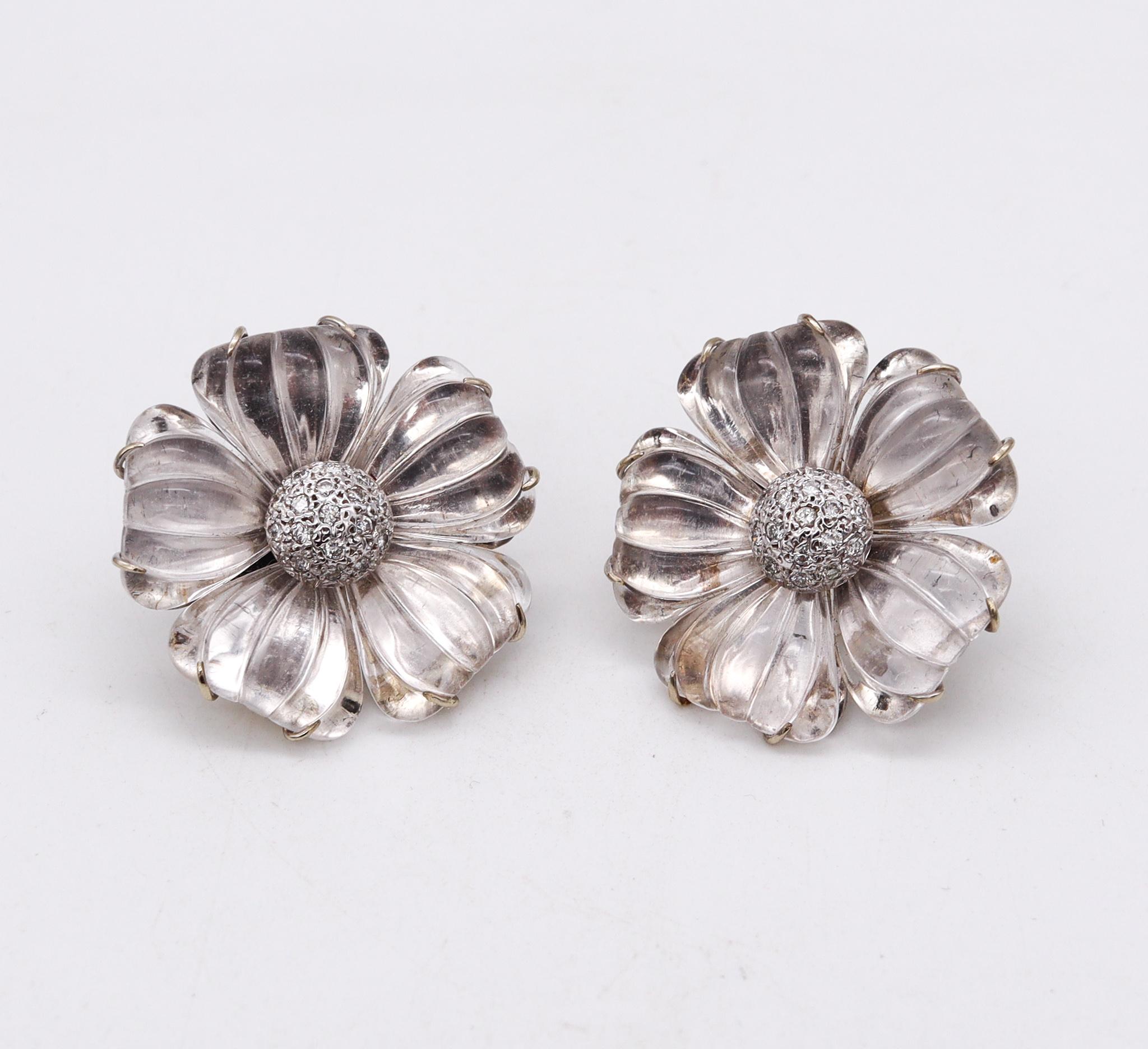 Pair of flower earrings designed by Bartholomew Mazza (Maz).

Very elusive pair of clip-on earrings, crafted in the shape of a six-petals flower in solid white gold of 18 karats. Suited with French omega backs for fastening clips and the post option