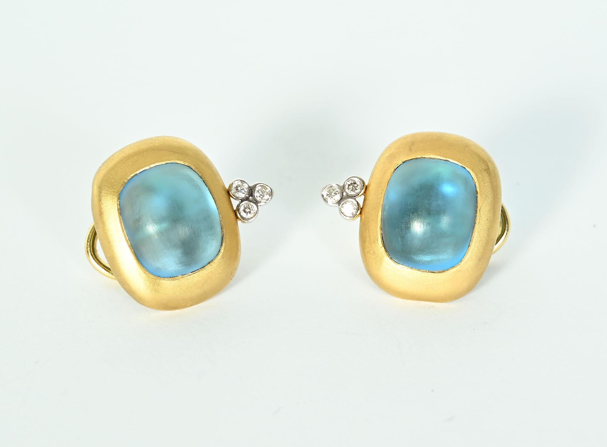 Colorful blue glass earrings with three diamonds below. Thet op part of the earring measures 3/4