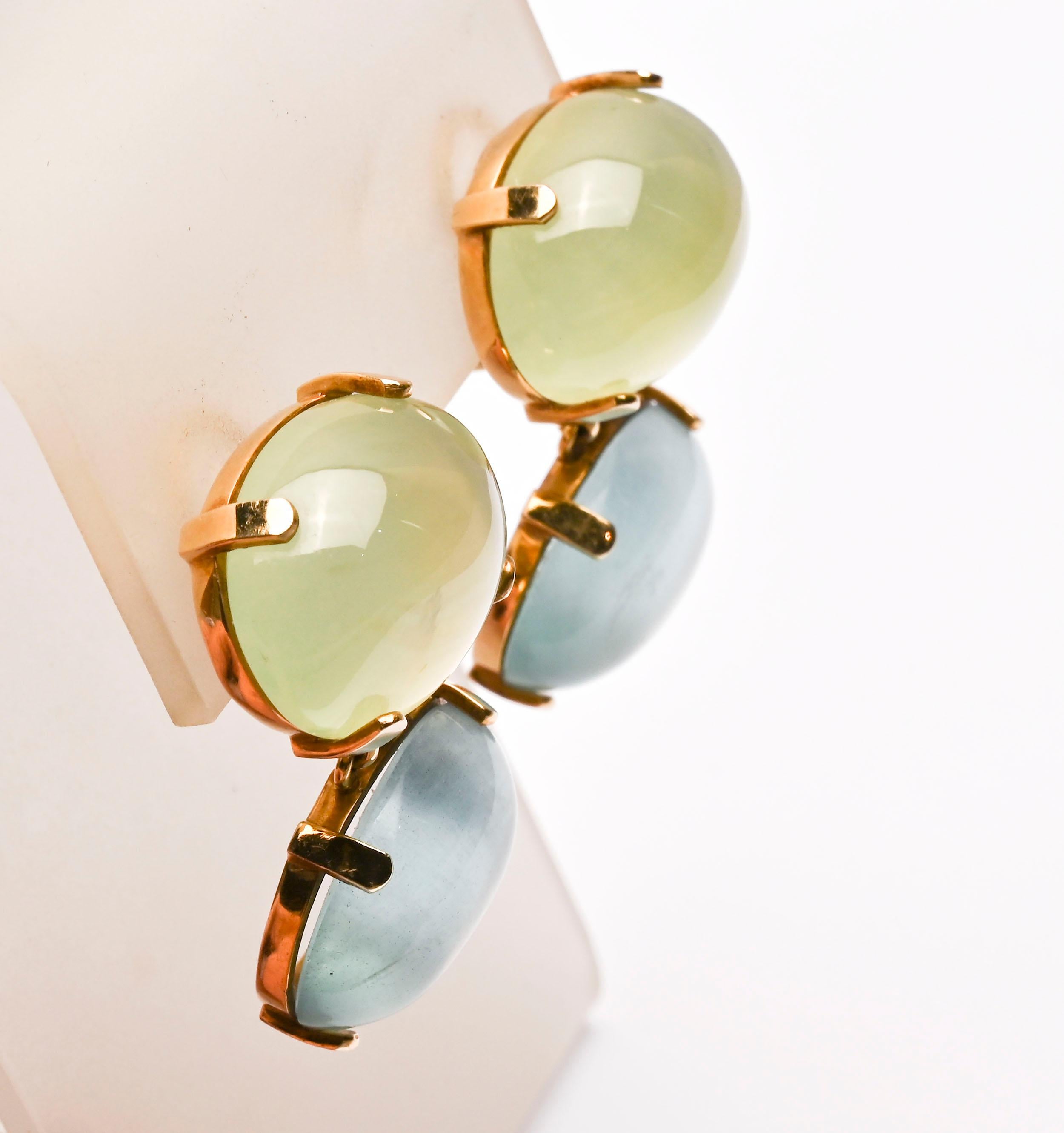 Fourteen karat earrings with fluorite made by Maz.  Fluorite (aka fluorspar) is a mineral that naturally occurs in all colors of the spectrum. The two stones in each of these earrings are well matched for their soft blue and green tones. Each stone