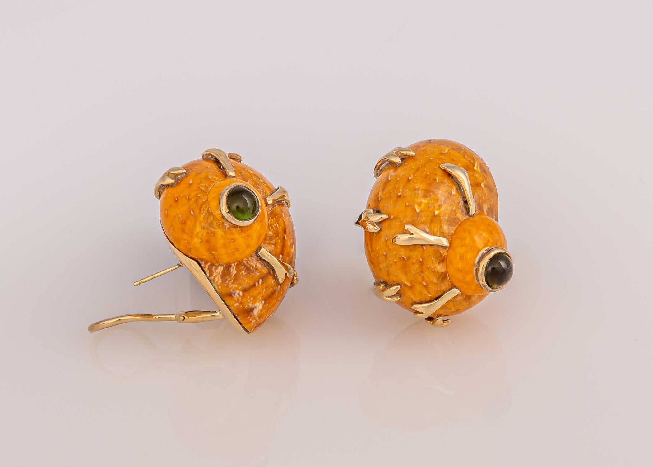Natural shell earrings are a great addition to any earring collection. Maz choose beautiful russet color shells and green tourmalines and added exceptional gold accents. A perfect choice you can enjoy year round. Approximately 1 1/8 inches in size.