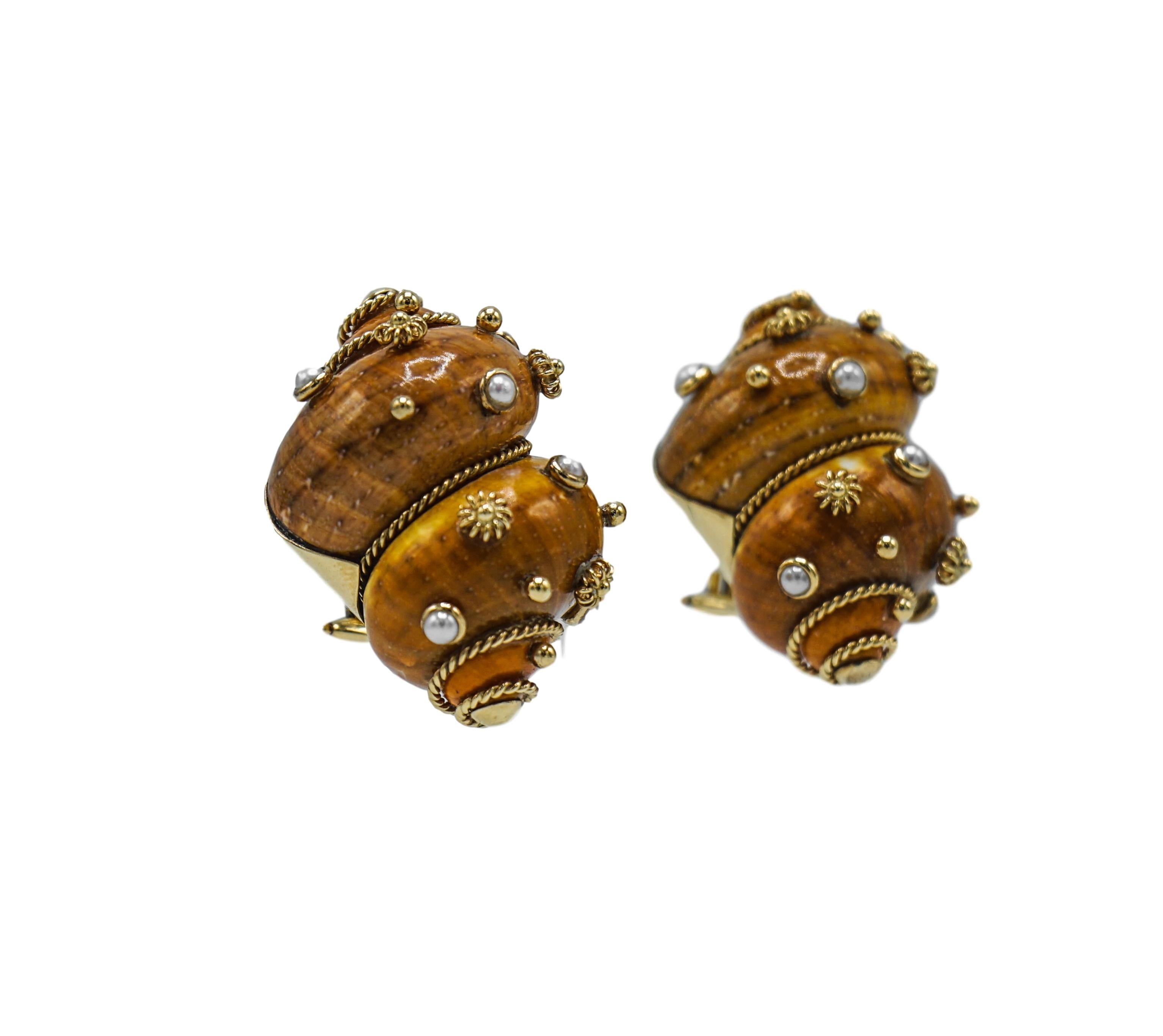 Pair of Gold, Shell and Cultured Pearl Earrings, Maz
14 kt., 2 brown shells ap. 34.0 x 23.0 mm., 12 pearls, signed Maz. 

PLEASE NOTE THAT ONE SHELL HAS A HAIRLINE CRACK AND CHIP. 
