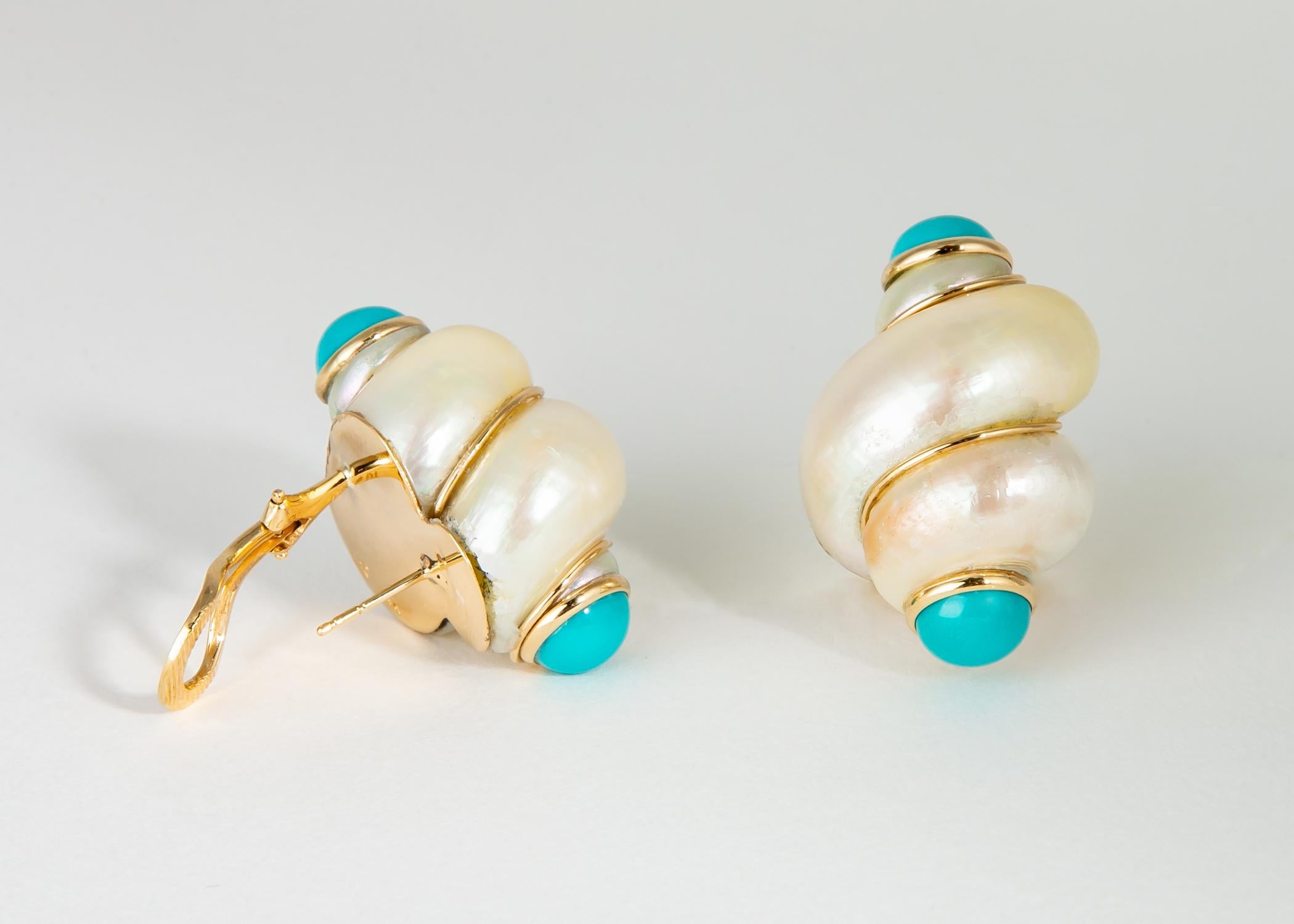 In the tradition of Seaman Schepps and Trianon Maz uses a natural shell adds turquoise accents to create this chic wearable earring.
