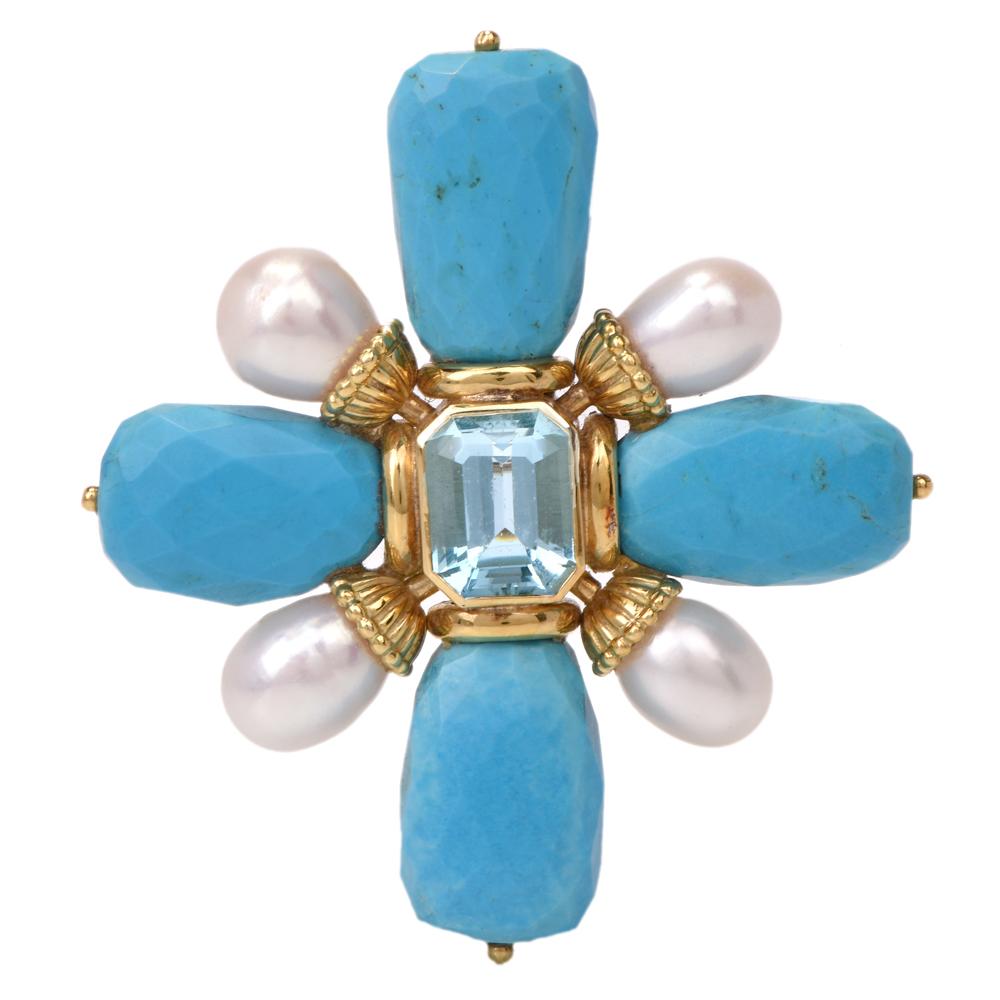 This alluring  cross turquoise, aquamarine, pearl brooch pendant enhancer is crafted in solid 18K yellow gold. Displaying 4-point turquoise cross with natural inclusions, centered by an emerald cut aquamarine approx. 9.00 carats bezel set into a 18K