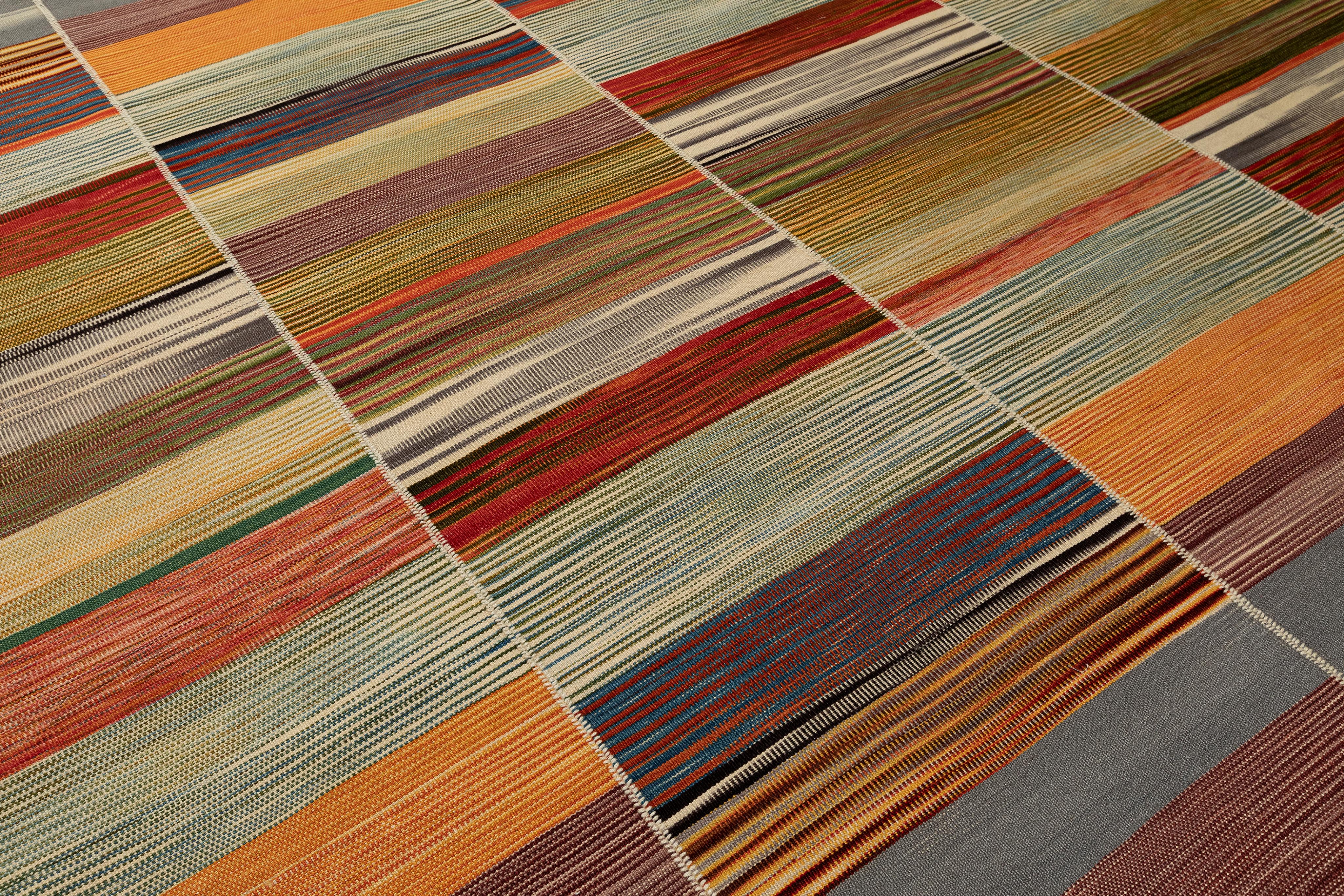 A captivating fusion of Persian heritage and modern expression, this Mazandaran Kilim Flatweave Rug by Nasiri Carpets showcases the artisanal brilliance of handwoven textiles with a painterly, multicolor composition. Drawing inspiration from