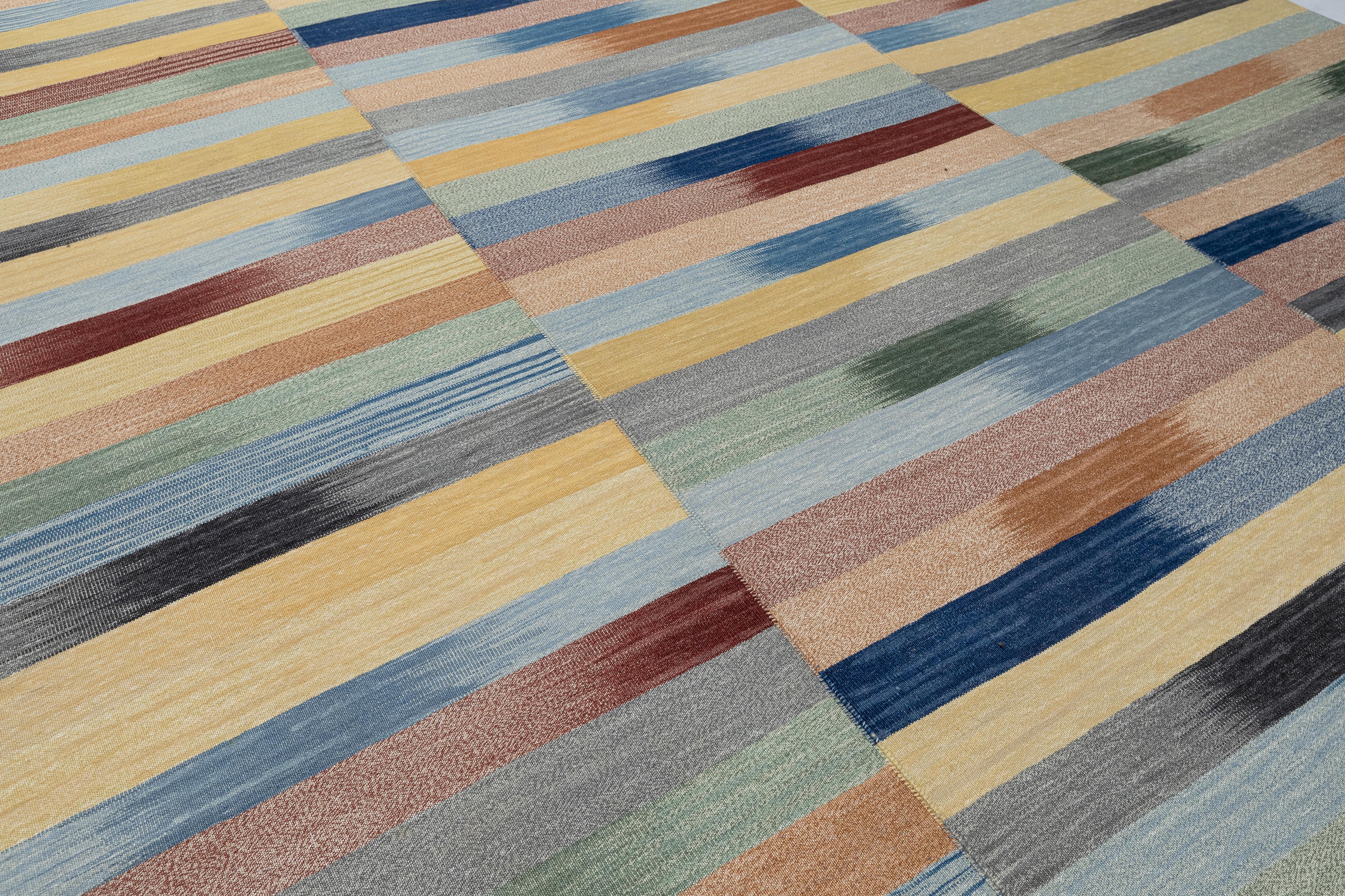 A vibrant, one-of-a-kind statement piece, this Mazandaran Kilim Flatweave Rug by Nasiri Carpets blends age-old Persian weaving techniques with a contemporary artistic sensibility. Handwoven in northern Iran using hand-spun wool and natural vegetable