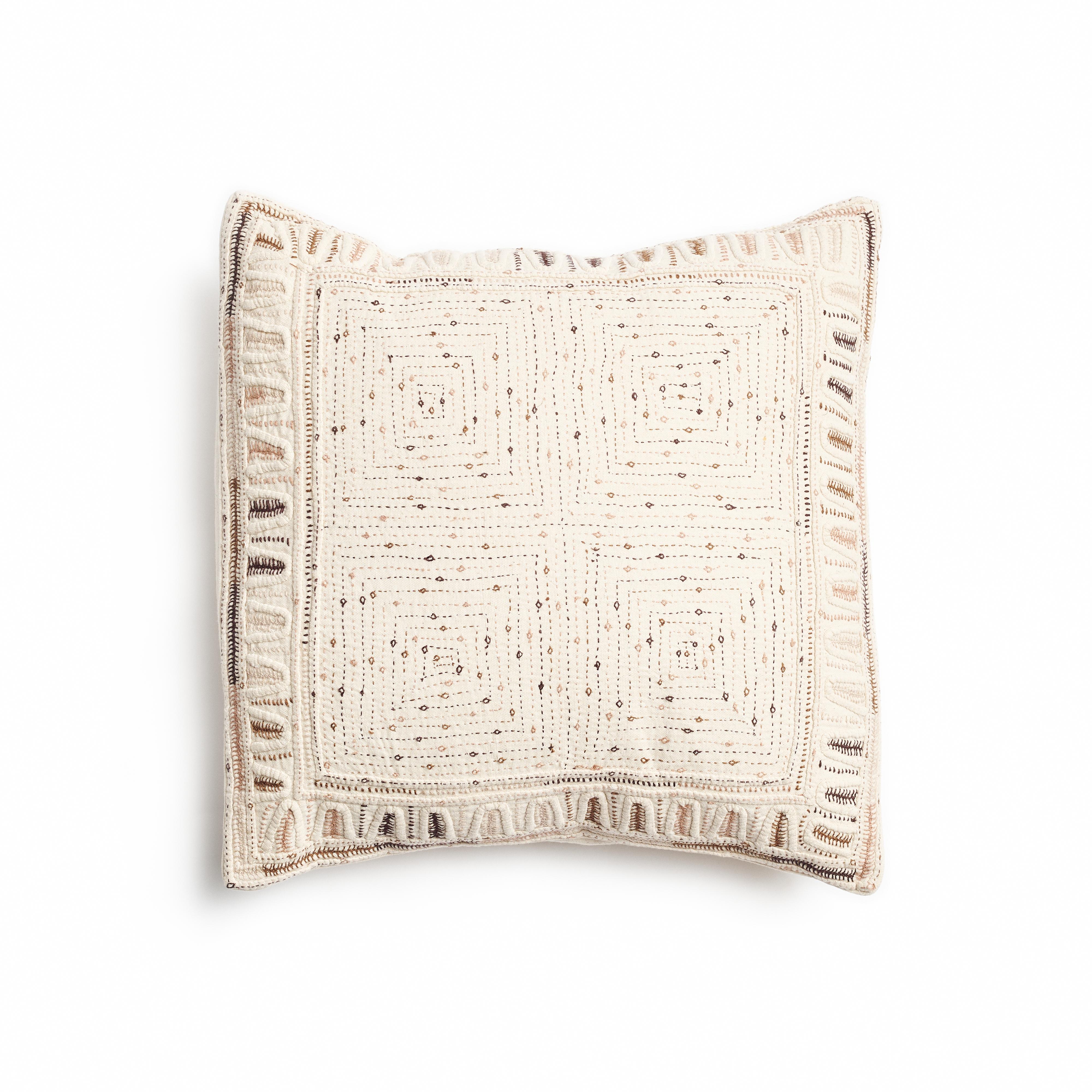 Maze is a fully hand embroidered pillow , with one of a kind beautiful handwork highlighting the borders in colorful tones and textural techniques.  Behind this piece is a unique group of artisan women in India. This particular technique is unique