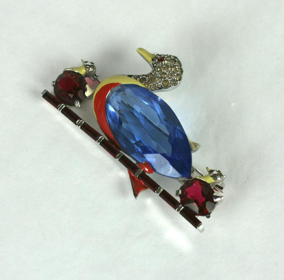 Collectible Mazer Art Deco Duck brooch with baby chicks. Wonderful design with cut stone bellies and enamel accents, floating on a line of faux ruby baguettes. 1930's USA. 
2.25