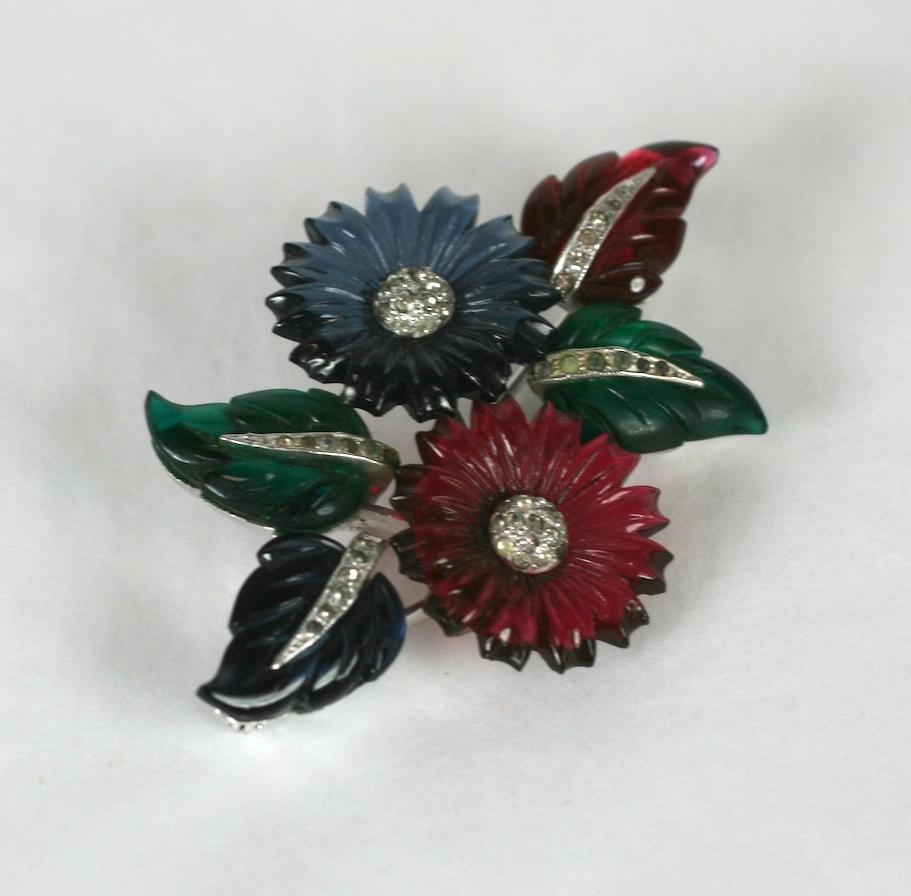 Mazer pave and tricolor  faux gemstone fruit salad flower and leaf spray. Set in rhodium plated base metal with crystal rhinestone pave and molded cut flower stones.
The flower and leaf designs were patented in 1938 by the designer Louis
