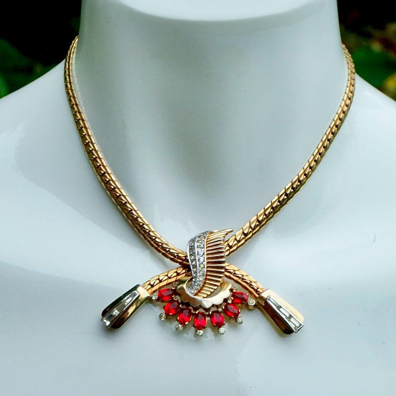 Mazer gold plated link chain necklace, featuring a beautiful red and clear rhinestone pendant centrepiece.

Measuring necklace length 37 cm / 14.5 inches, and the maximum length of the centrepiece is 7 cm / 2.75 inches by width 4 cm / 1.5 inches.