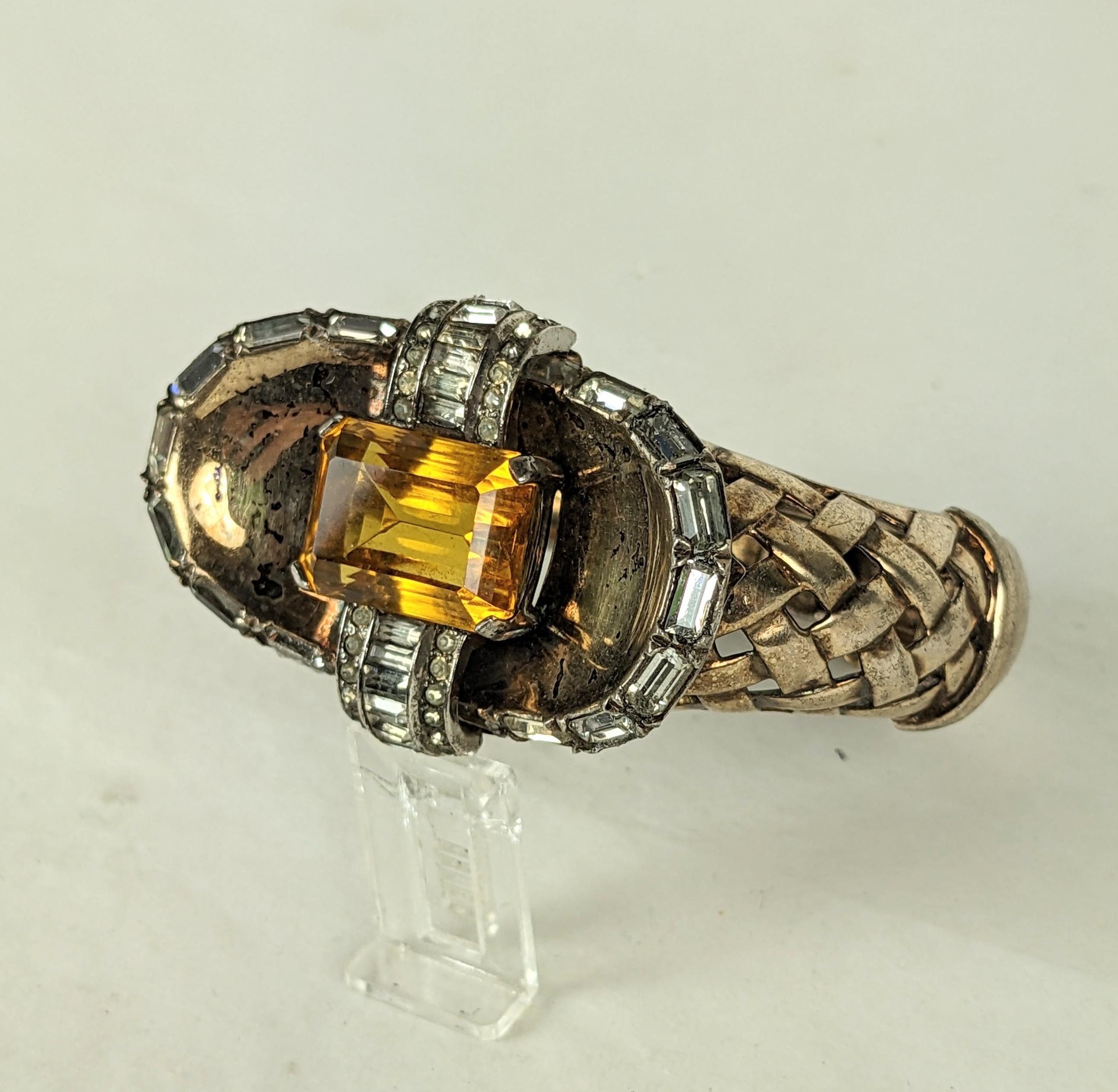 Striking Mazer Retro Faux Citrine Basketweave Cuff in sterling vermeil. Heavy sterling cuff set with a large faux topaz and baguette paste centerpiece. 1940's USA Mazer. 
Top motif, 2