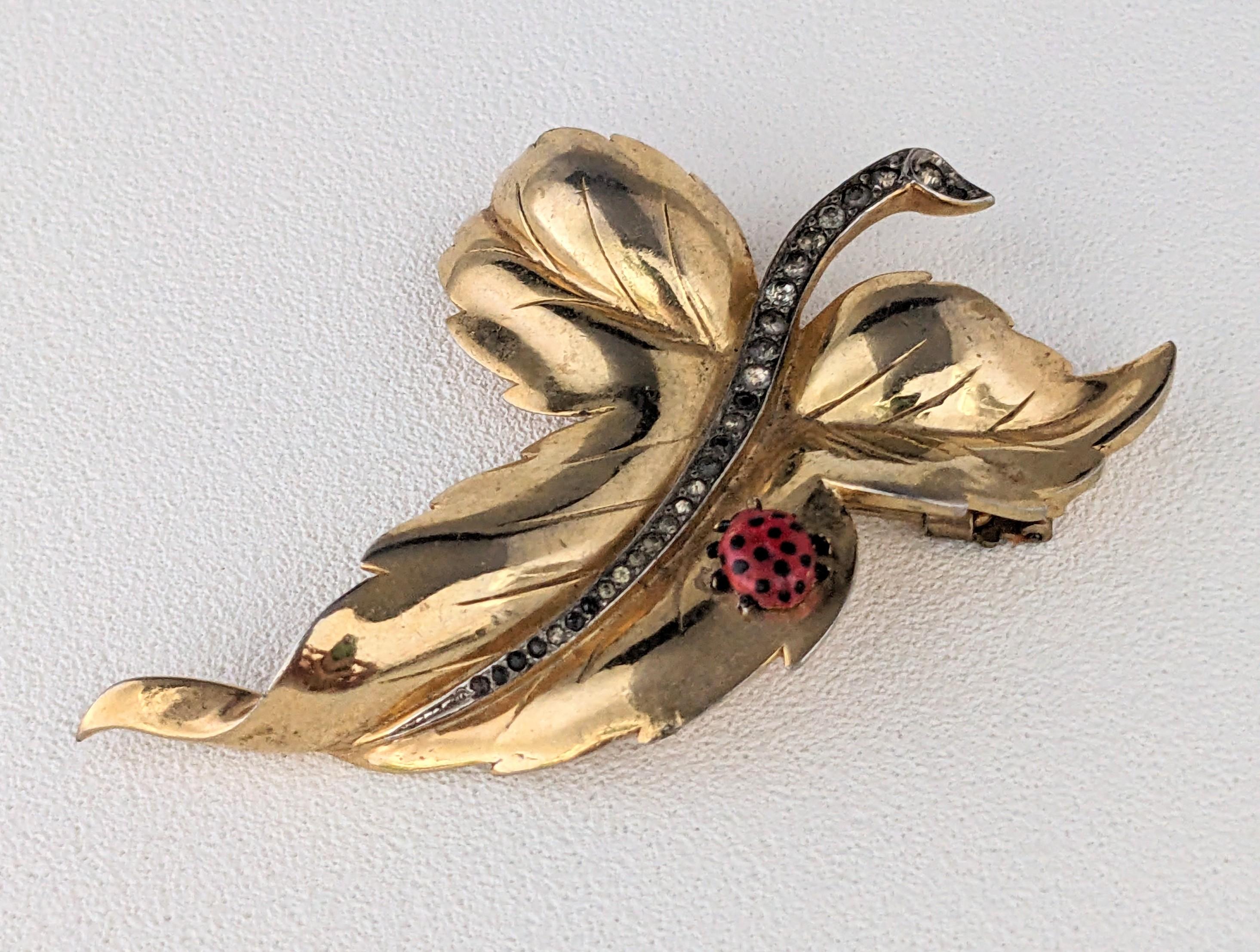 Striking Mazer Retro Leaf Clip with Enamel Butterfly from the 1940's. Gilt metal leaf with pave detailed stem and hand enamel lady bug. 1940's USA, Signed Mazer. 2.5