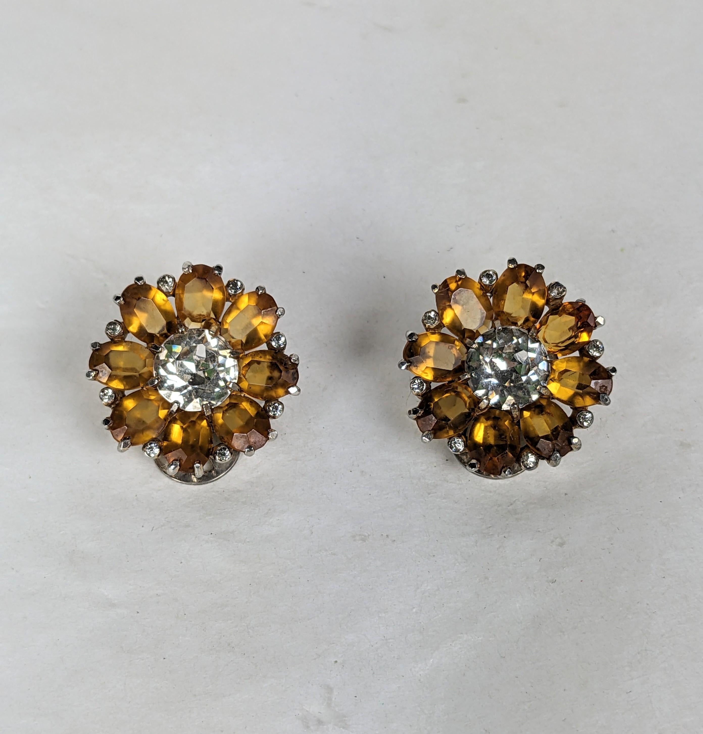 Mazer topaz flower head earclips of gold plated base metal, crystal rhinestones and oval faceted faux topaz stones. signed Mazer (on clips). L.75