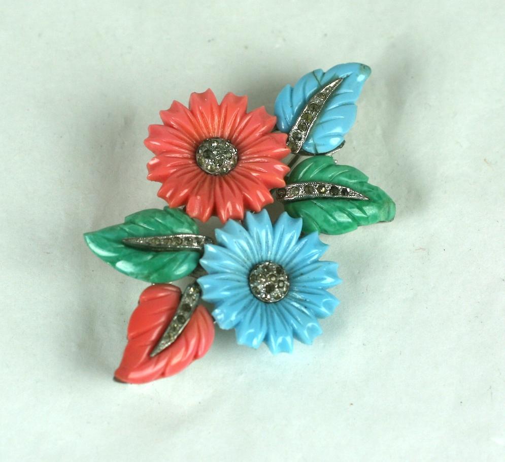 Art Deco Mazer tricolor fruit salad flower and leaf spray brooch of rhodium plated base metal, crystal rhinestones, faux coral, jade and turquoise pressed and hand finished glass fruit salad leaves and flower heads.
Patents for the leaves and