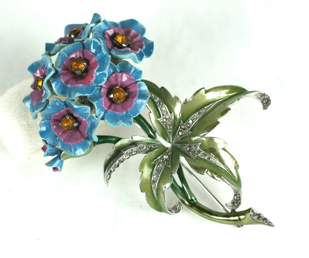 Beautiful and rare Art Deco Mazer enameled flower brooch from the 1930's. The naturalistic Verbena floral stalk, painted with pearlized and shiny cold enamels. The flower heads of bright turquoise, with eyes of deep mauve and centers of faux faceted