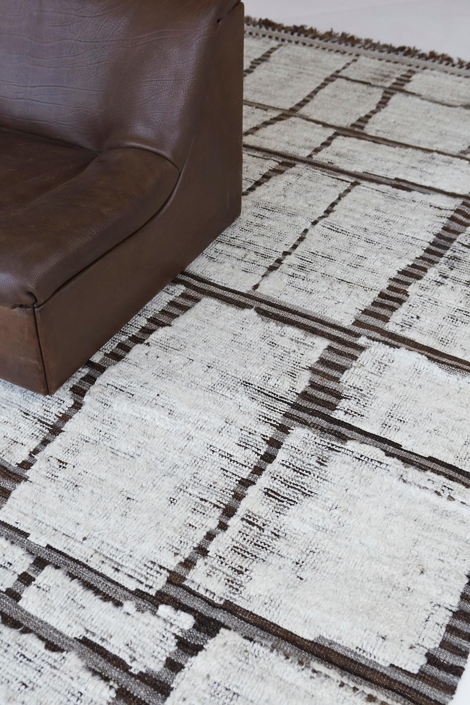 Maziere is a handwoven wool piece with unique design elements that mirror roman masonry. This luxurious striped brown and cream pile weave shag makes for the perfect contemporary. Maziere is designed in Los Angeles for the modern design