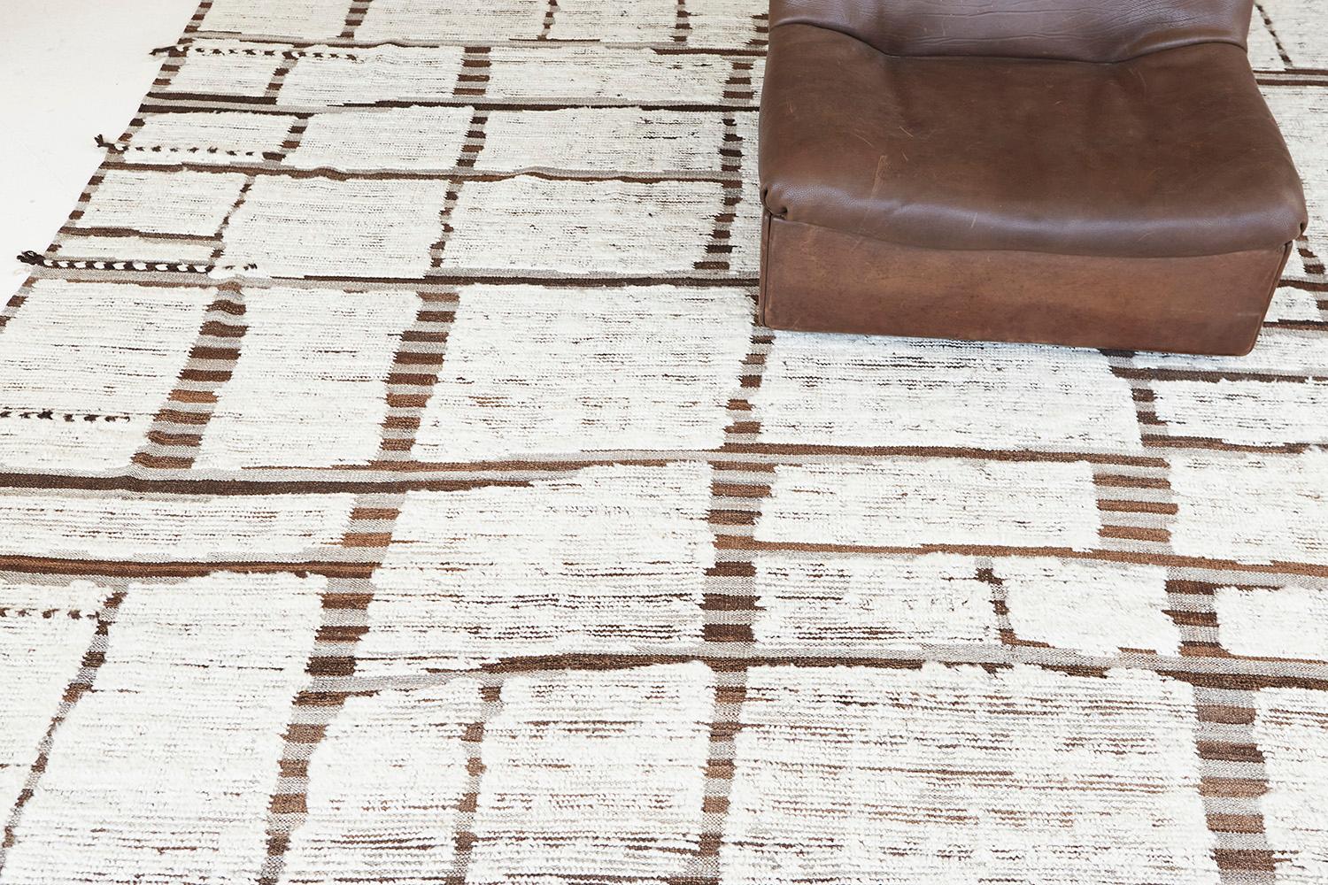 Maziere' is a handwoven wool piece with unique design elements that mirror roman masonry. This luxurious striped brown and cedar pile weave and ivory shag make for the perfect contemporary. Maziere is designed in Los Angeles for the modern design