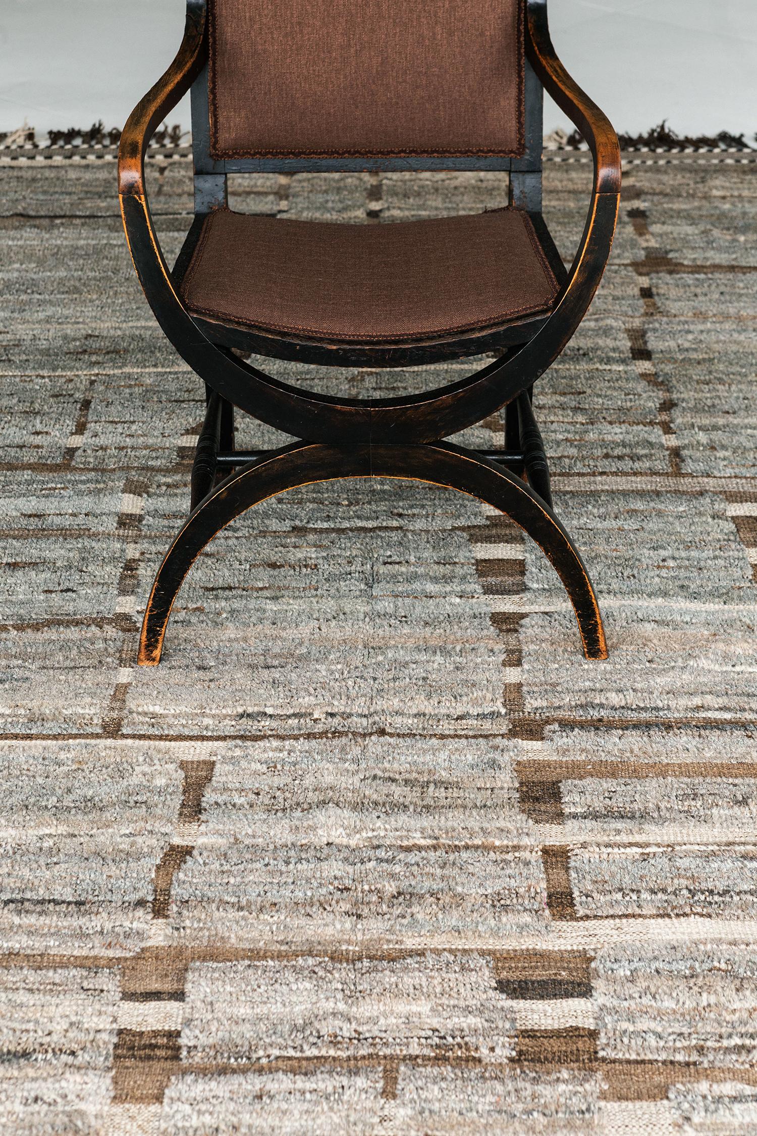 Maziere' is a handwoven wool piece with unique design elements that mirror roman masonry. This luxurious striped brown and ivory pile weave and blue-gray shag make for the perfect contemporary. Maziere is designed in Los Angeles for the modern