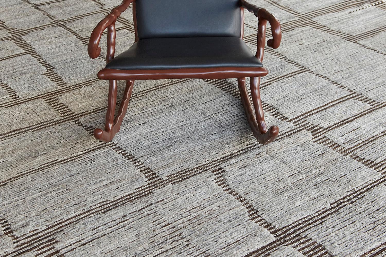 Maziere' is a handwoven wool piece with unique design elements that mirror roman masonry. This luxurious striped brown and khaki pile weave and natural brown shag make for the perfect contemporary. Maziere is designed in Los Angeles for the modern