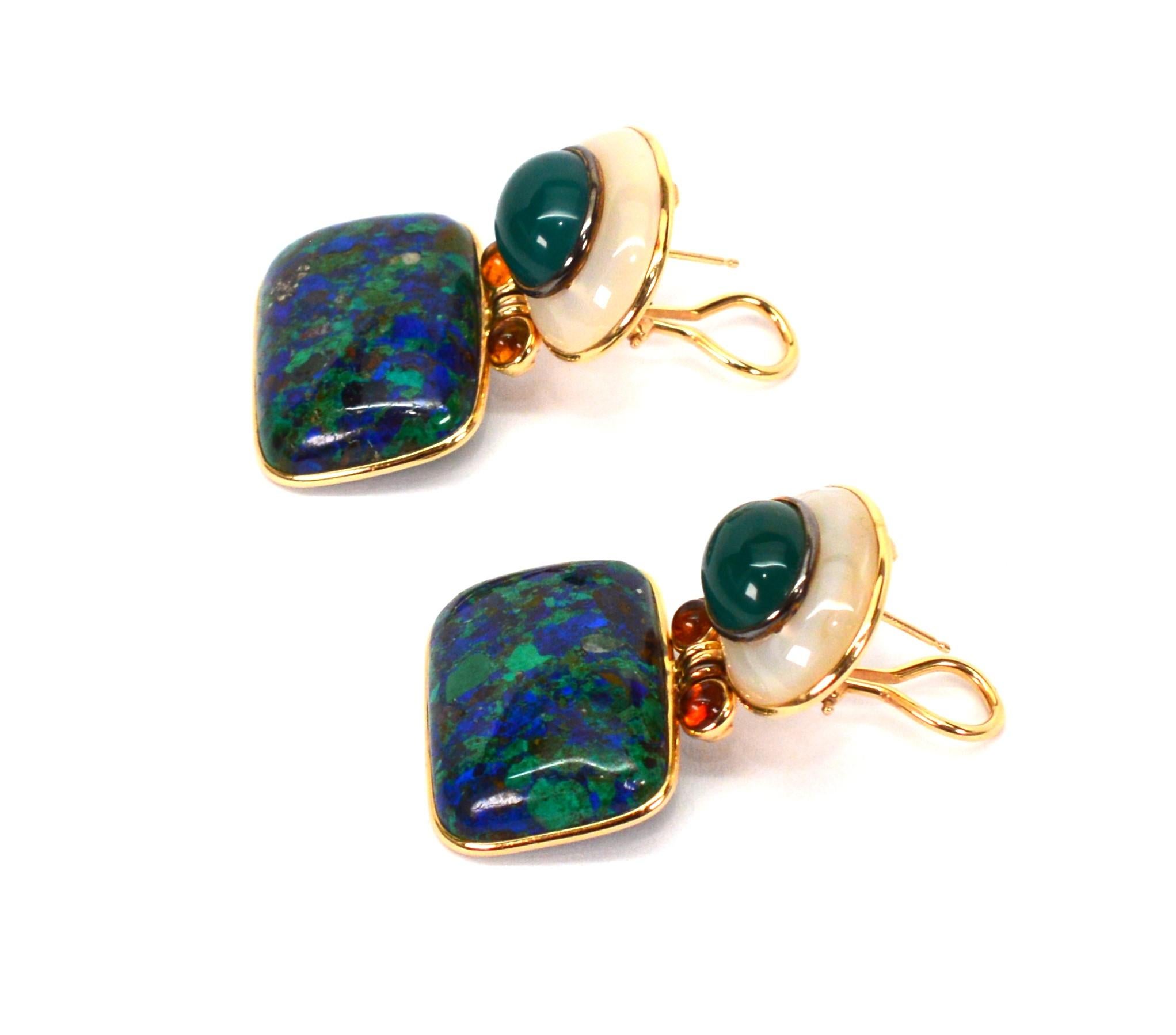 Fabulous and funky, attractive geo shapes with vibrant earthy color are showcased in this earring pair by designer Diane Mazza. All framed in 14 karat yellow gold, iridescent Mother of Pearl enhanced with a oval jade center cabochon start the pair