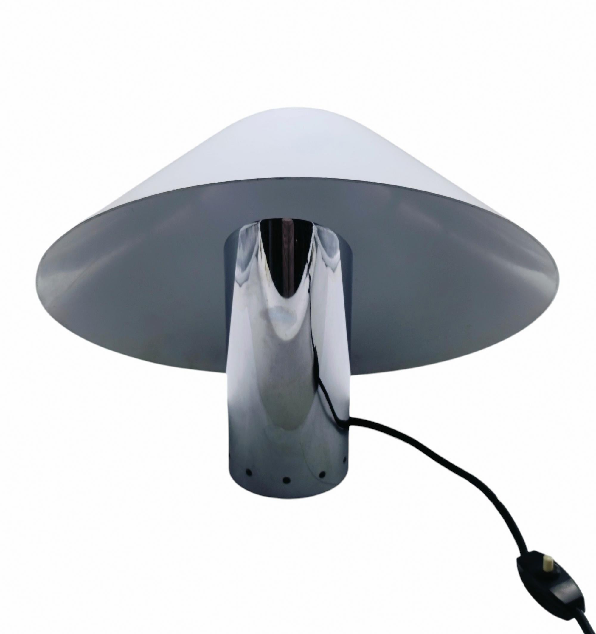 Table Lamp  space age designed in the 1970s by Giuliana Gramigna and Sergio Mazza for Quattrifolio. Chrome metal base and white enameled metal lampshade. The Lamp is in good condition.Sergio Mazza is an Italian designer born in Milan in 1931. He