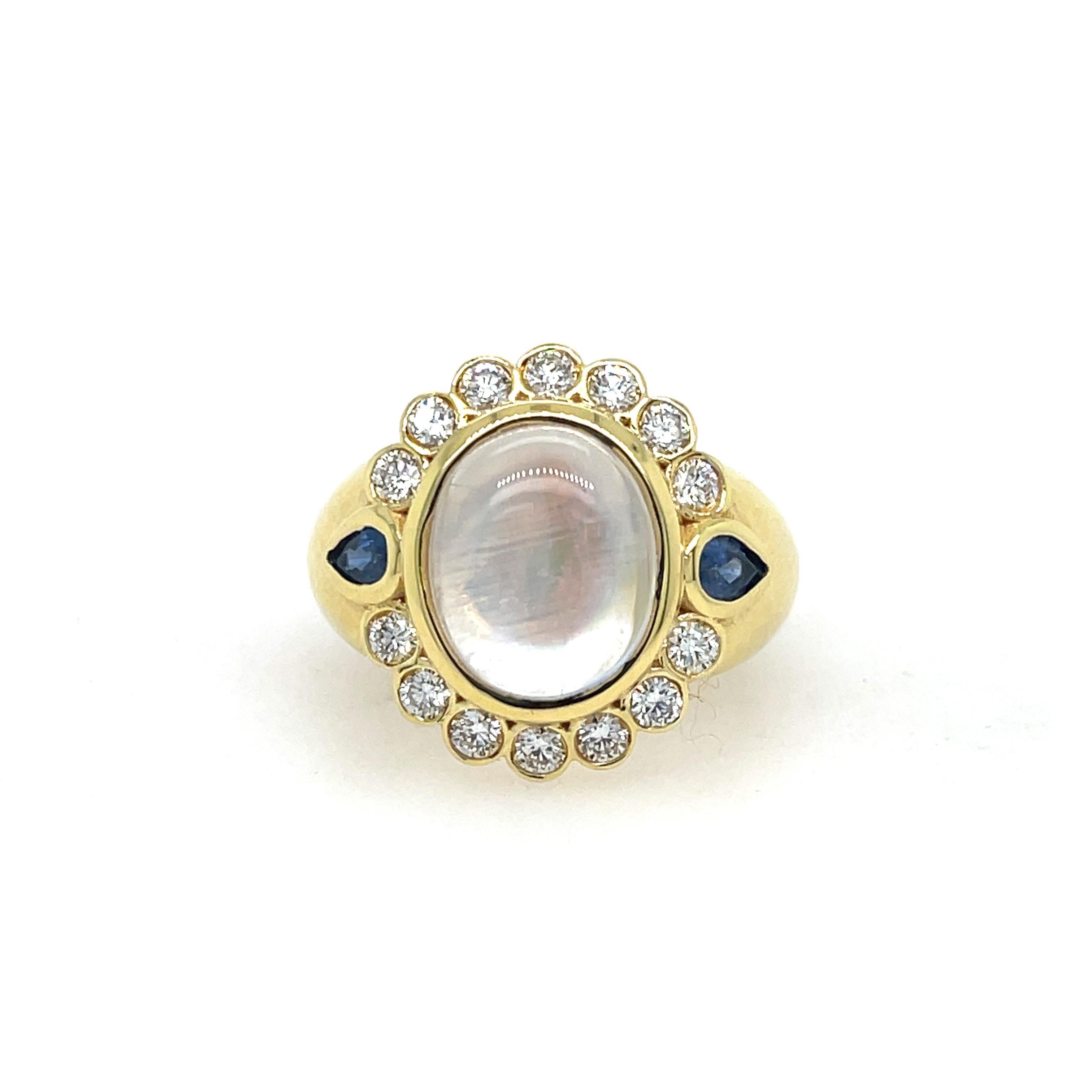 Mazza Moonstone, Sapphire, & Diamond Ring In 14K Yellow Gold. The Ring Features A Cabochon Moonstone, Two Pear Shape Blue Sapphires, & 0.70 Ctw Of Round Diamonds. Ring Size 7.