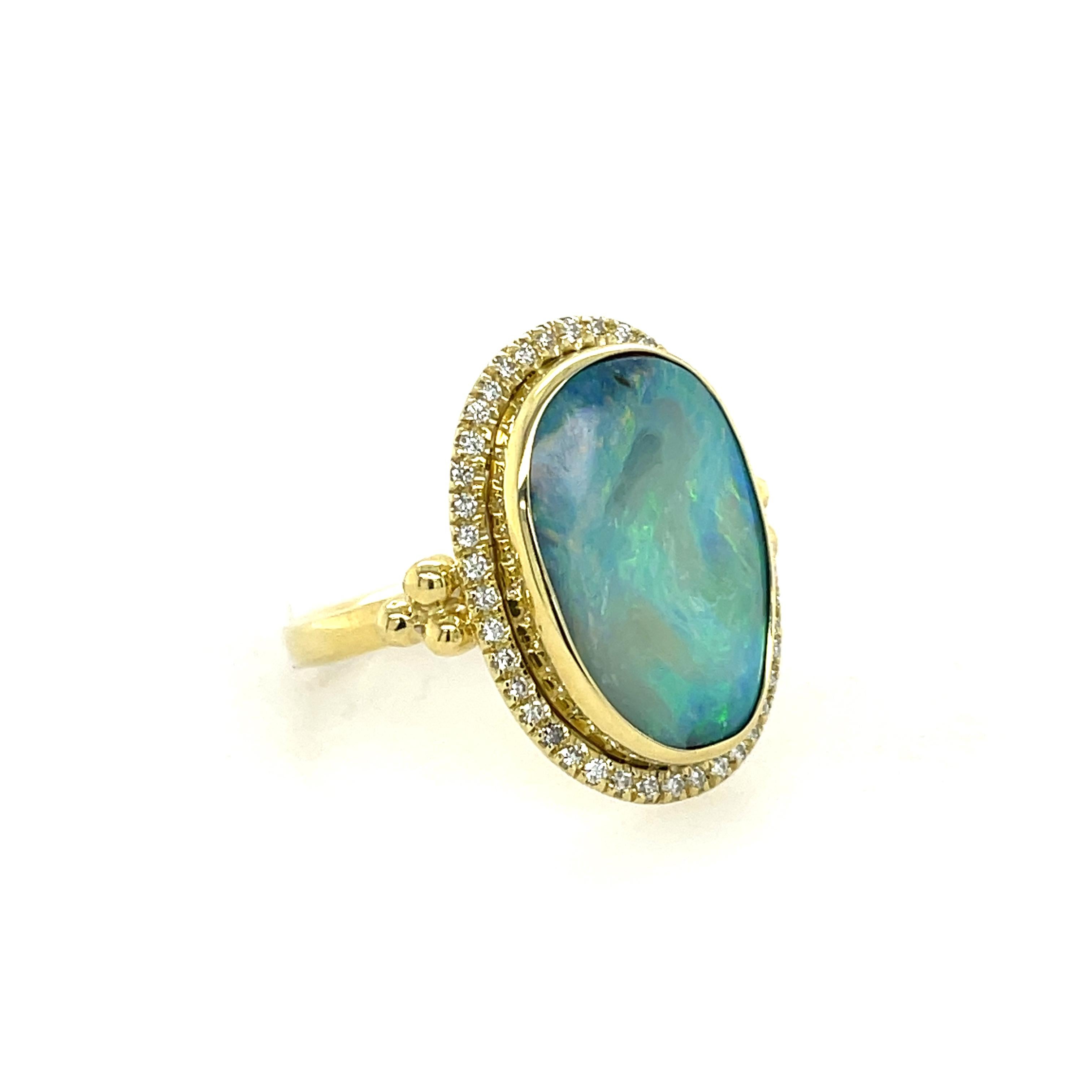 Mazza Opal & Diamond Ring In 18K Yellow Gold. The Ring Features A 8.10Ct Opal With A Halo Of 0.21Ctw Of Round Diamonds. Ring Size 7.