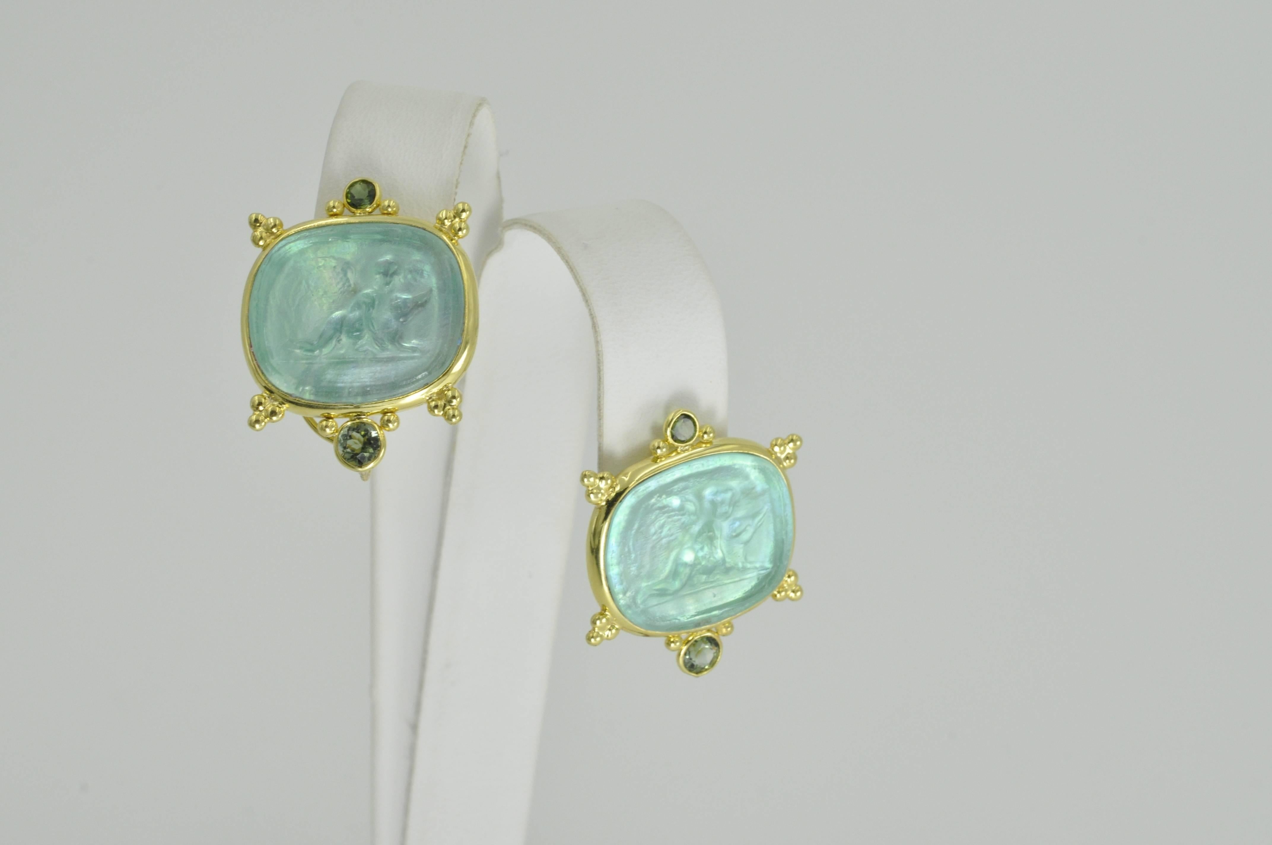 Venetian Glass Earrings with two round Green Tourmalines per earring, designed by Mazza in 14k Yellow Gold.
Charms may also dangle off the bottom of these beautiful earrings. 
